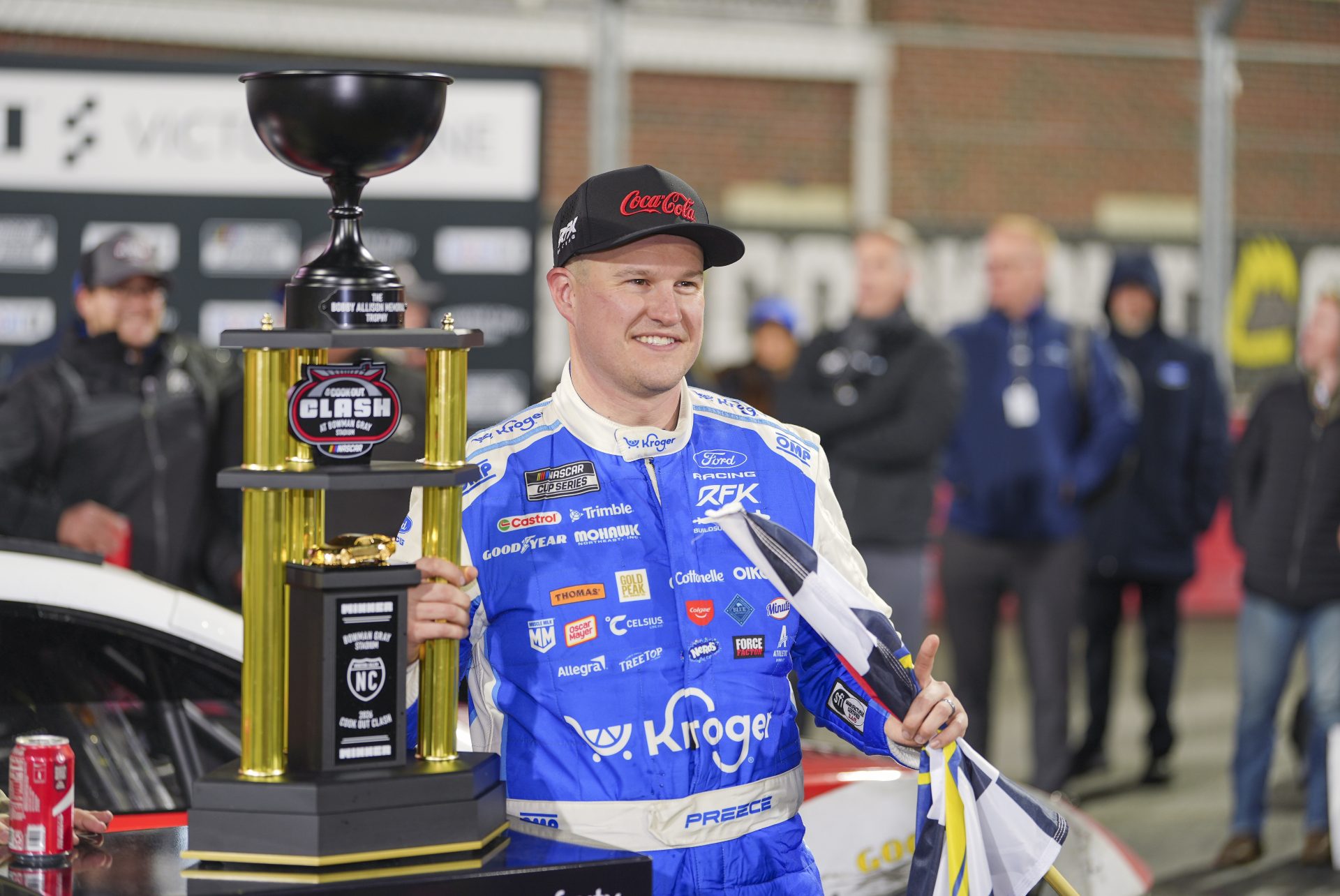 NASCAR Cup Series driver Ryan Preece (60) holds the Bobby Allison Memorial Trophy after winning the Cook Out Clash at Bowman Gray Stadium.