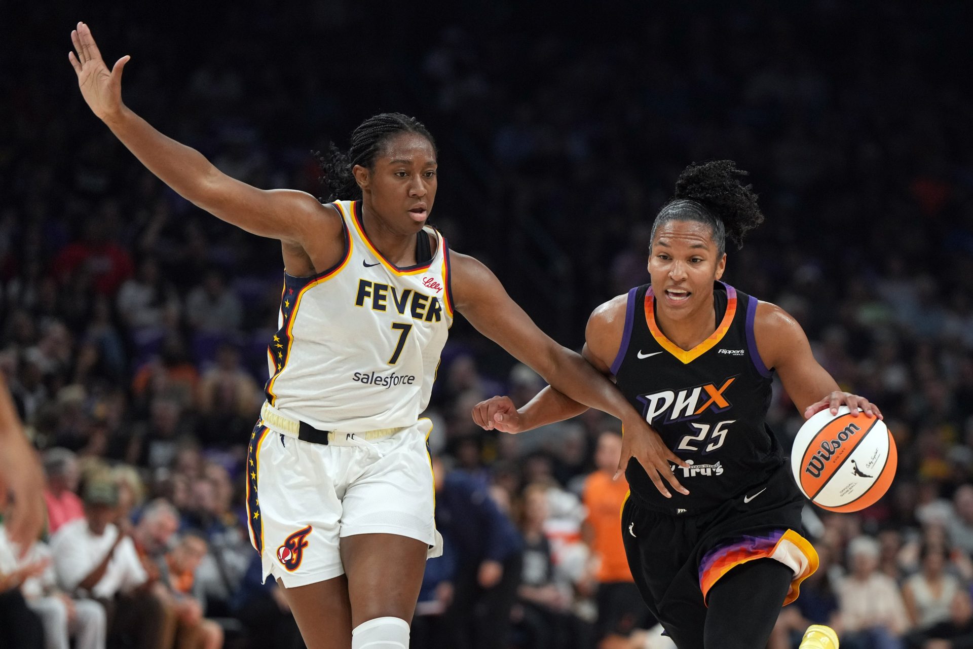 Phoenix Mercury forward Alyssa Thomas (25) drives on Indiana Fever forward Aliyah Boston (7) in the first half at PHX Arena.