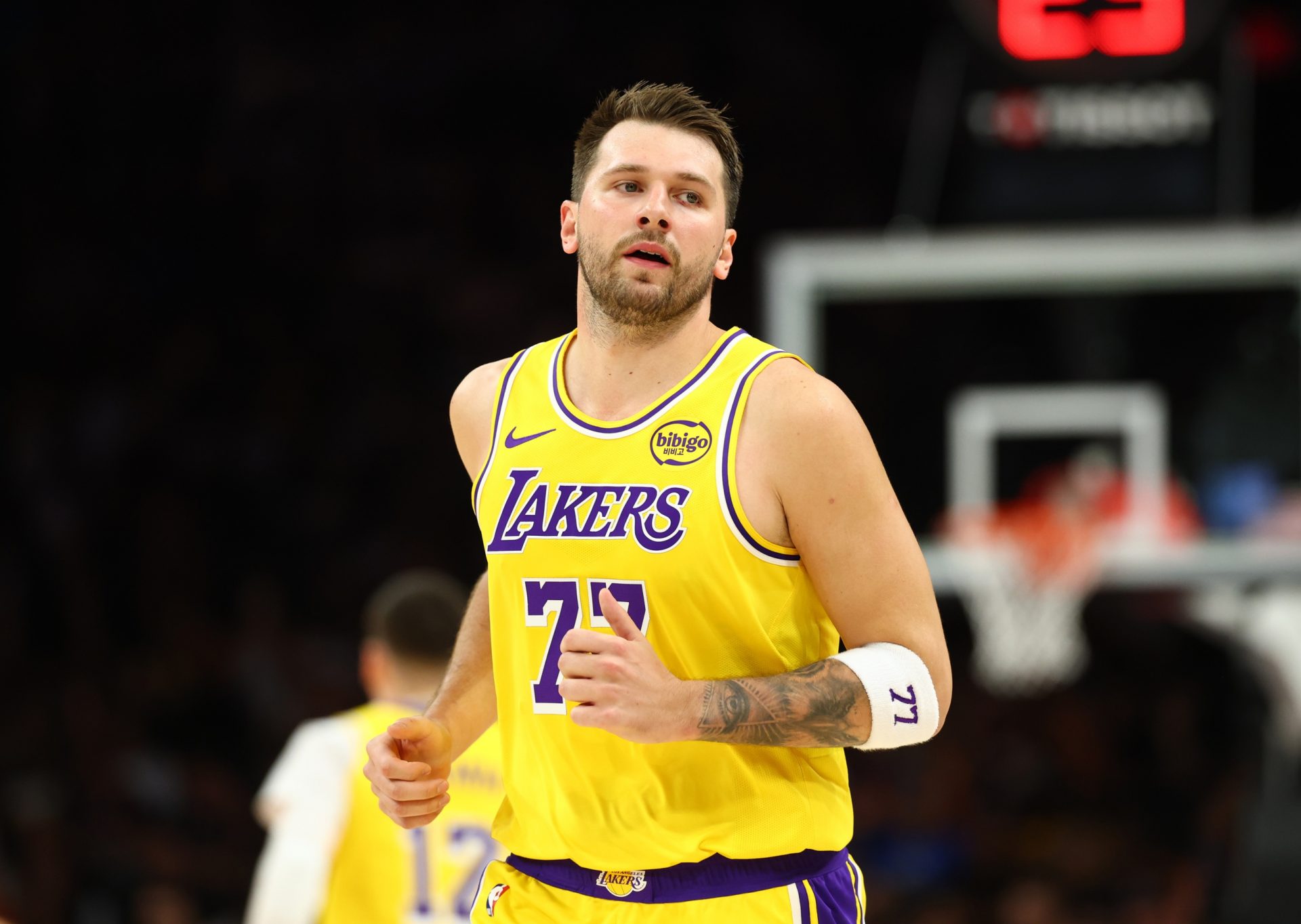 Los Angeles Lakers guard Luka Doncic (77) against the Phoenix Suns in the first half at Mortgage Matchup Center - Source - Imagn Images