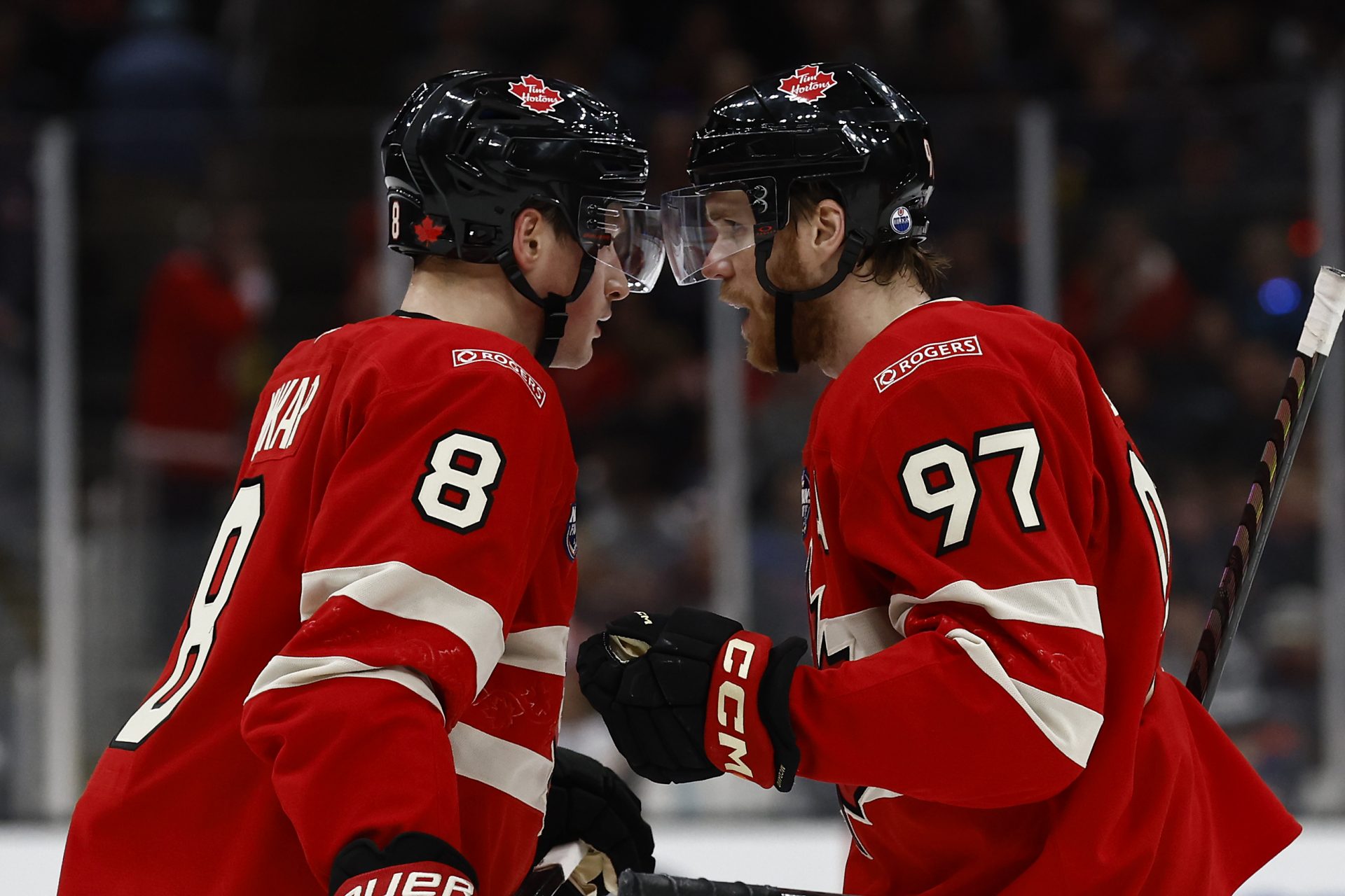 Team Canada forward Connor McDavid (97) talks with defenseman Cale Makar (8) during the 4 Nations Face-Off ice hockey championship game against the United States at TD Garden.