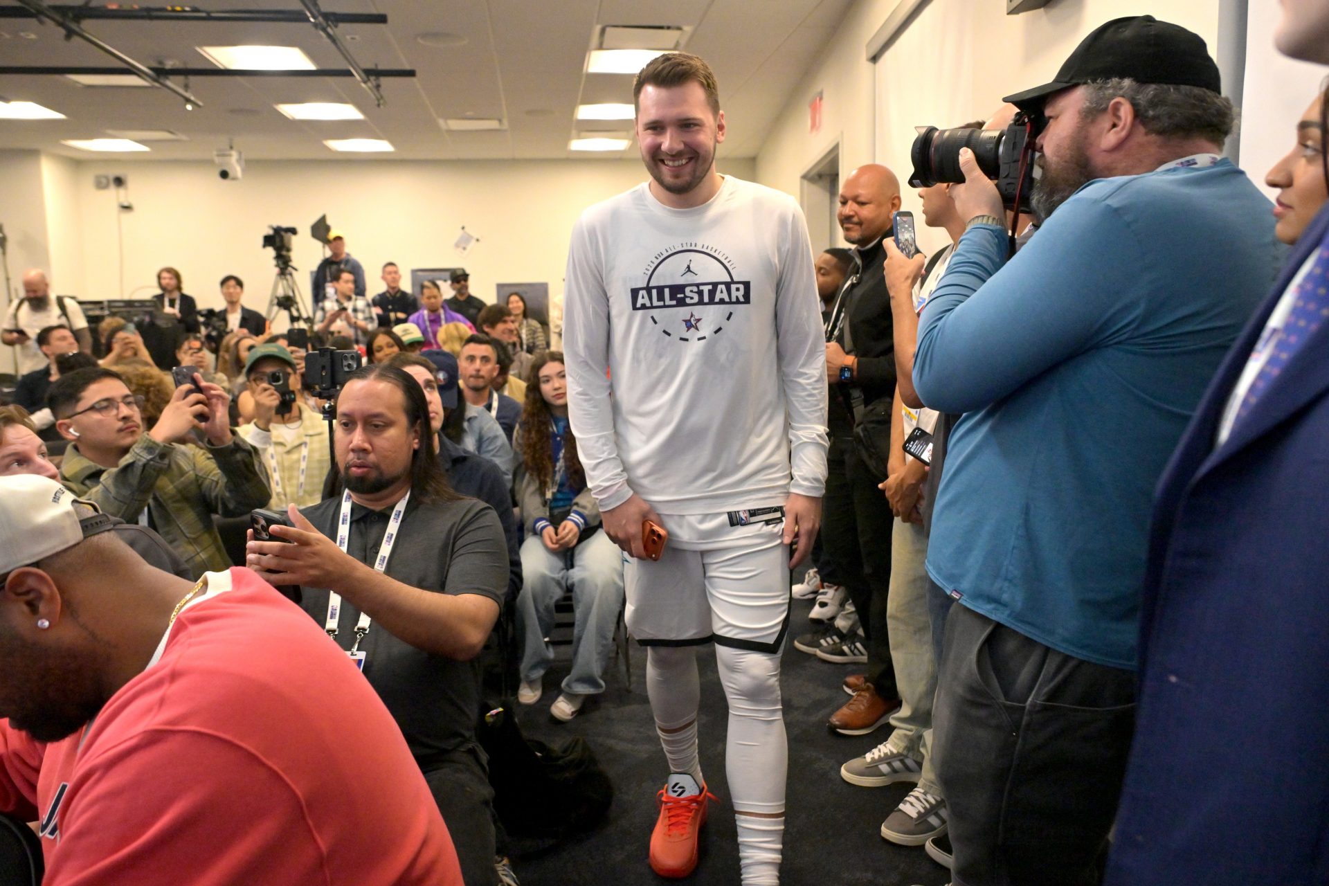 Team World guard Luka Doncic (77) of the Los Angeles Lakers arrives for a news conference for the NBA All Star game at Intuit Dome.