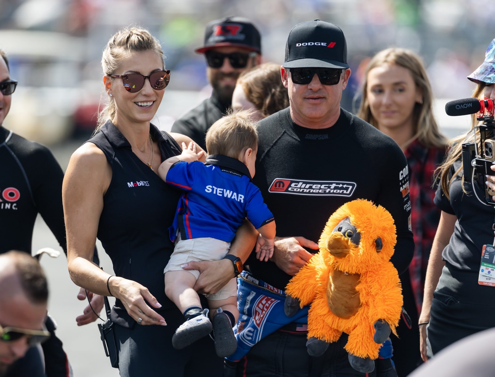 NHRA top fuel driver Tony Stewart with wife Leah Pruett and son Dominic Stewart during qualifying for the US Nationals at Lucas Oil Indianapolis Raceway Park.