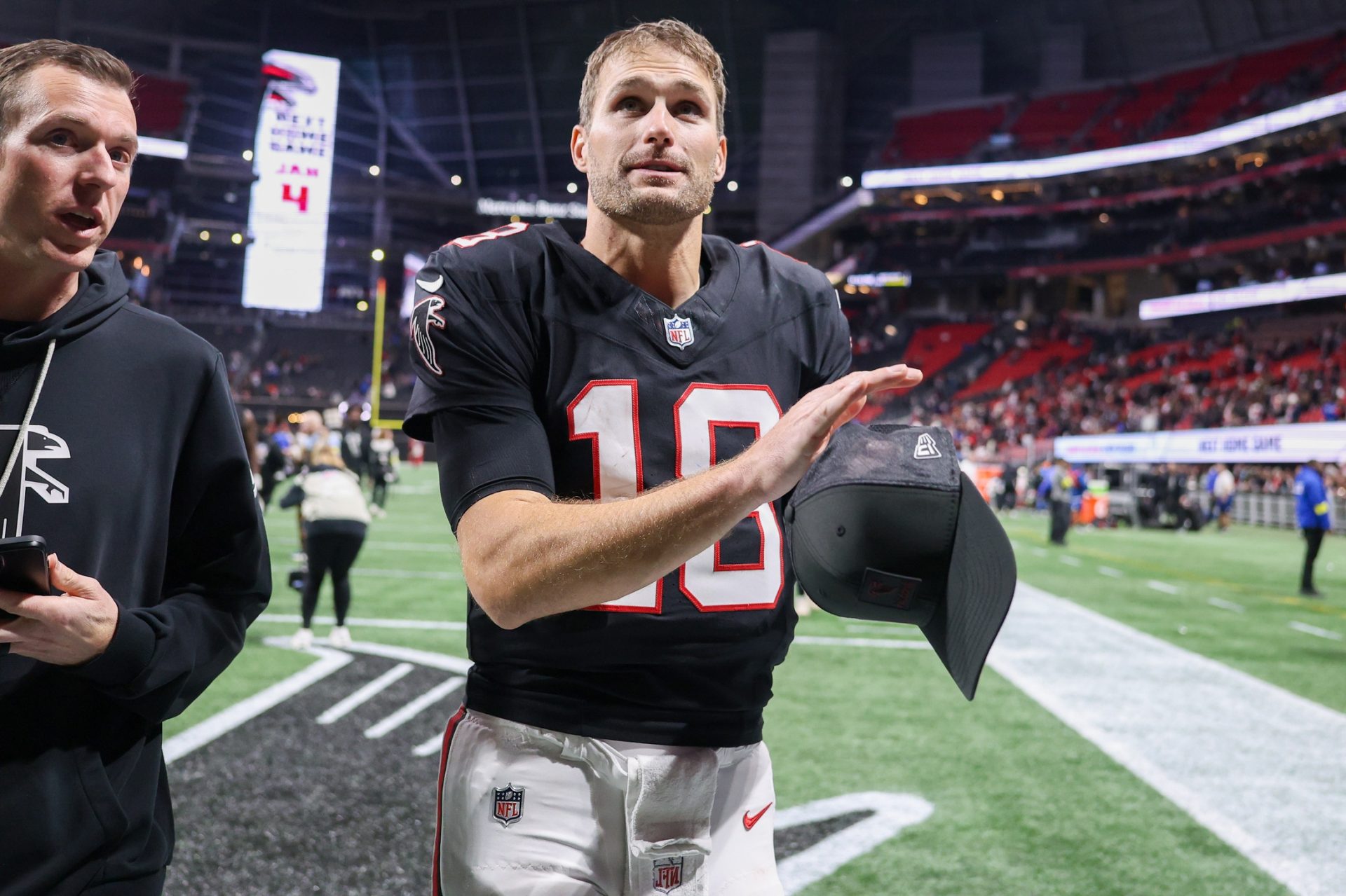 Atlanta Falcons quarterback Kirk Cousins (18) celebrates after a victory over the Los Angeles Rams at Mercedes-Benz Stadium.