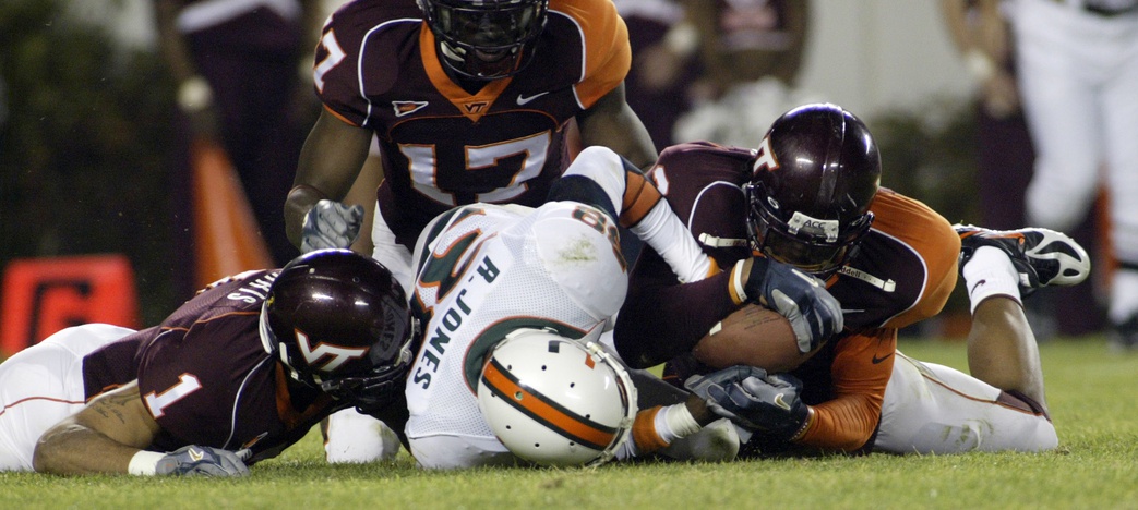 Virginia Tech Hokies defender Jimmy Williams (2) wrestles a fumble from the Miami Hurricanes  Rashaun Jones (38) during 2nd qtr action of the Hokies matchup with the Hurricanes at Lane Stadium/Worsham Field.