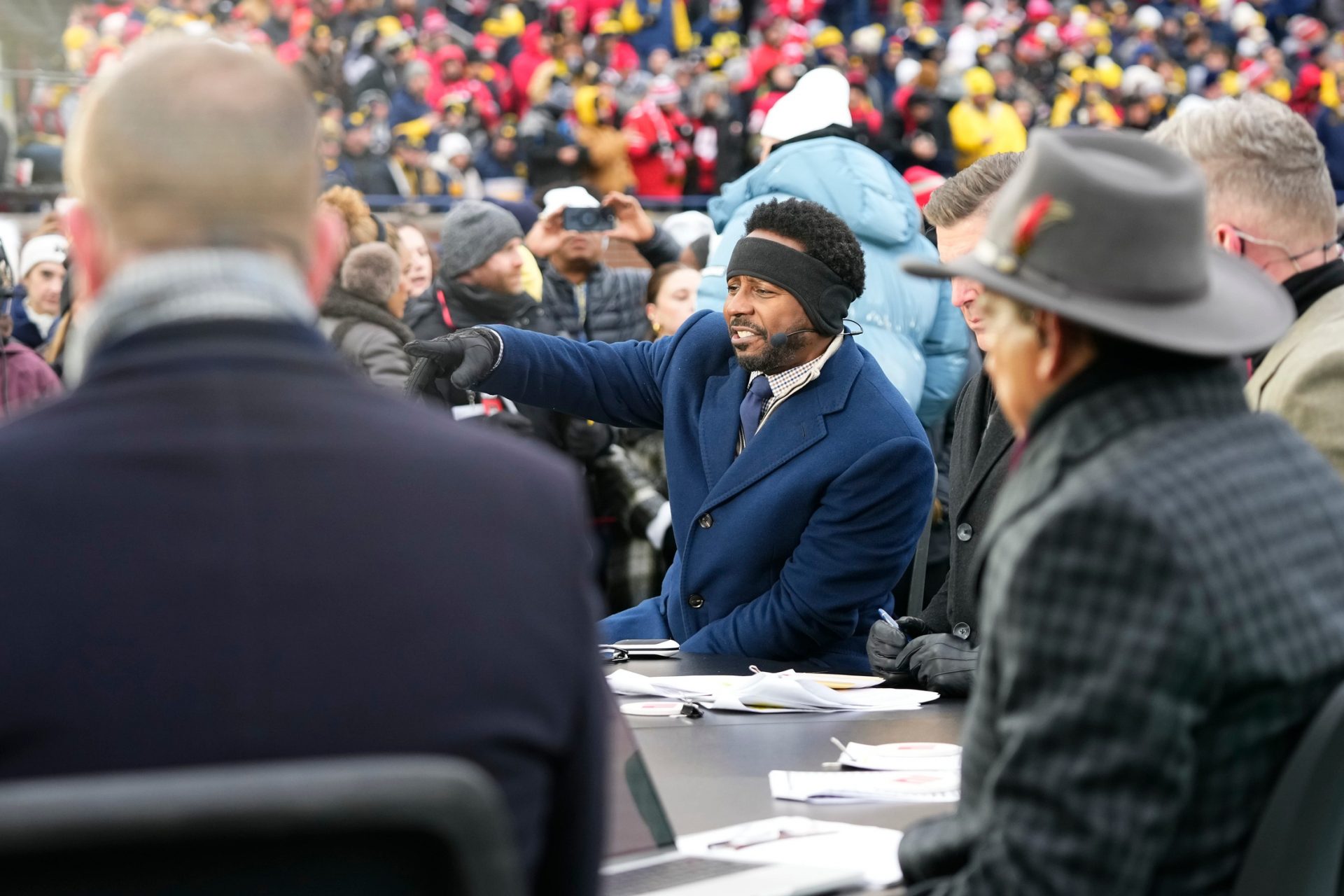 Desmond Howard and the ESPN College GameDay crew broadcast from the field at Michigan Stadium during the NCAA football game between the Michigan Wolverines and the Ohio State Buckeyes in Ann Arbor, Mich. on Nov. 29, 2025. Ohio State won 27-9.