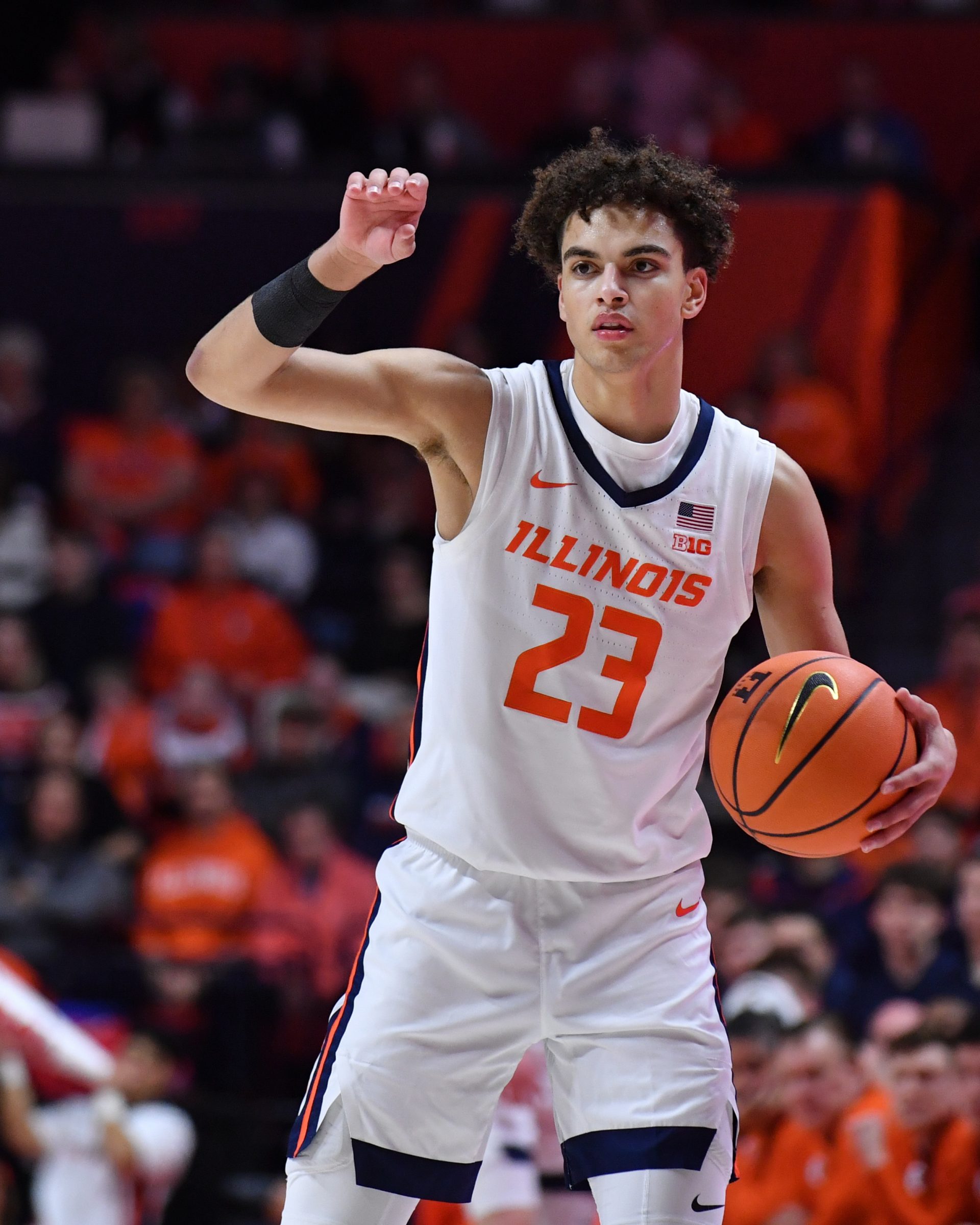 Illinois Fighting Illini guard Keaton Wagler (23) directs the offense during the first half against the Wisconsin Badgers at State Farm Center.