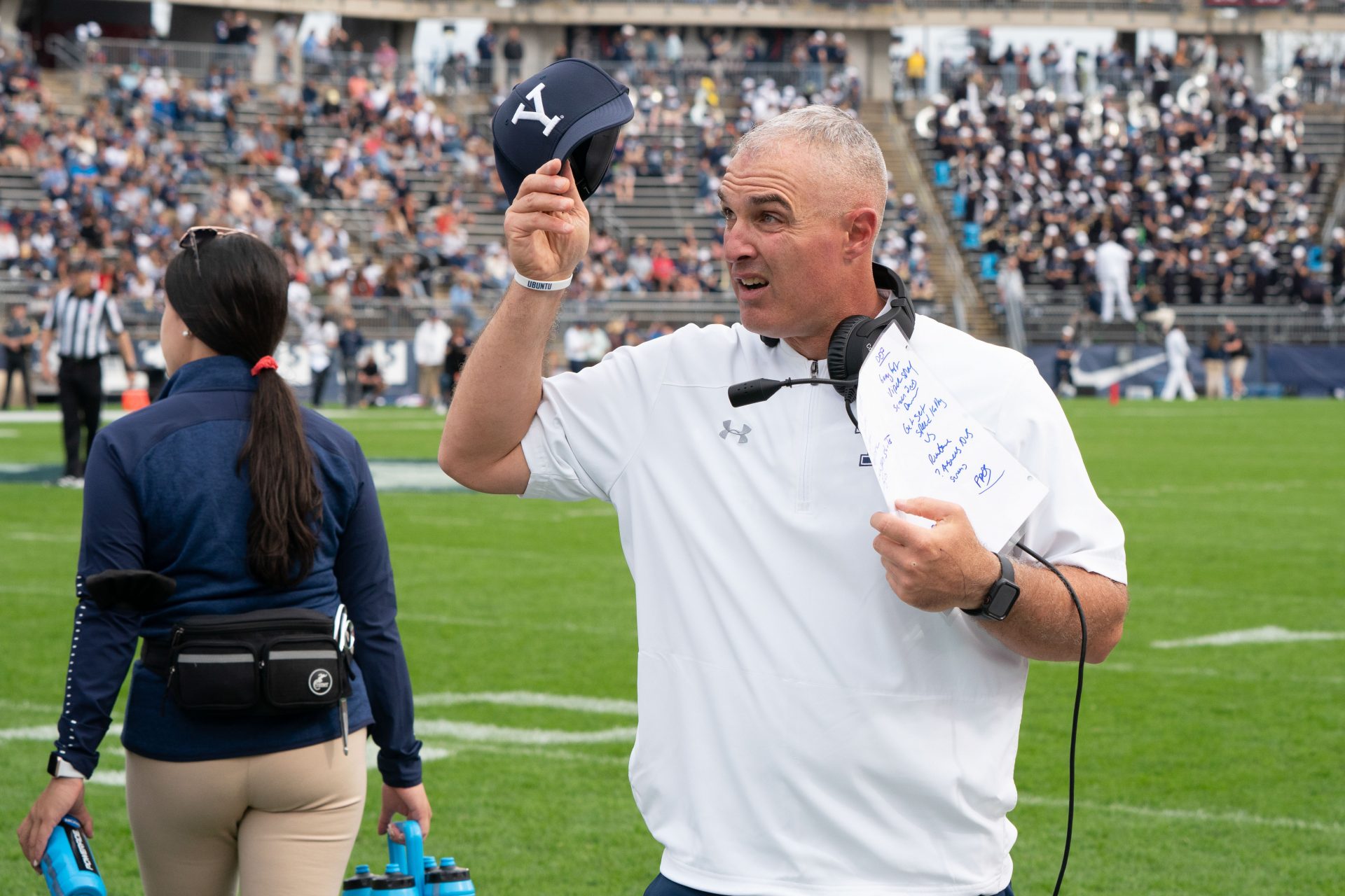 Yale Bulldogs head coach Tony Reno looks up at the scoreboard during the first half against the Connecticut Huskies at Rentschler Field at Pratt & Whitney Stadium.
