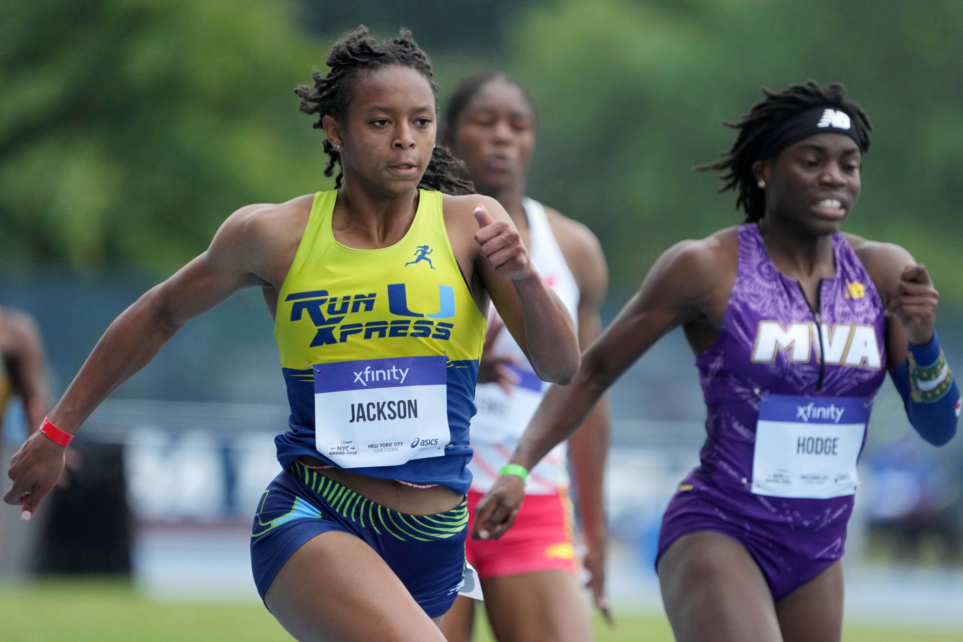 Shawnti Jackson (USA), left, defeats Adaejah Hodge (IVB) to win the high school girls 200m in 22.70 to 22.85 during the USATF Grand Prix at Icahn Stadium - Source: Imagn