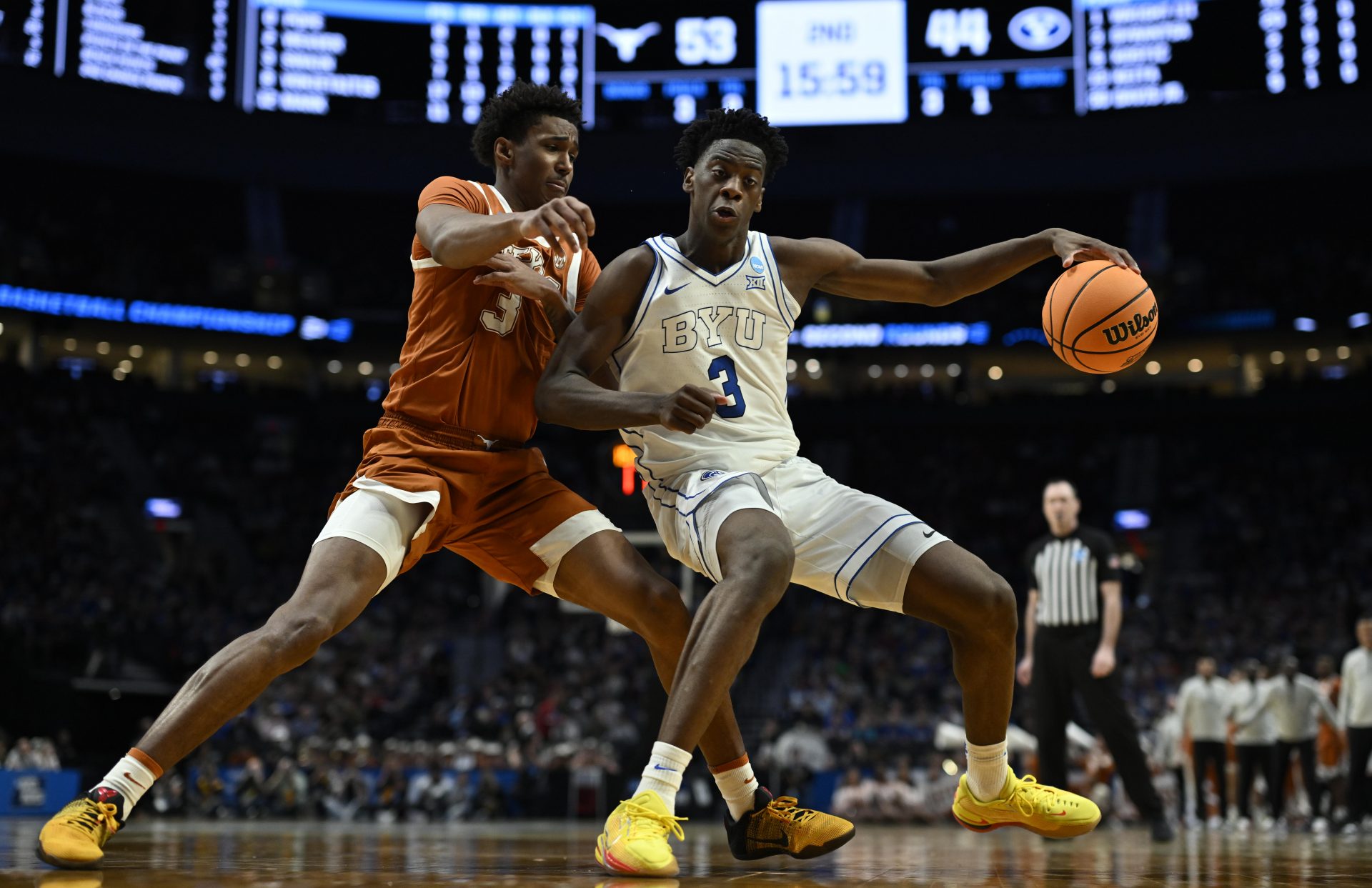 BYU Cougars forward AJ Dybantsa (3) dribbles against Texas Longhorns forward Dailyn Swain (3) in the second half during a first round game of the men's 2026 NCAA Tournament at Moda Center. Source: Troy Wayrynen-Imagn Images