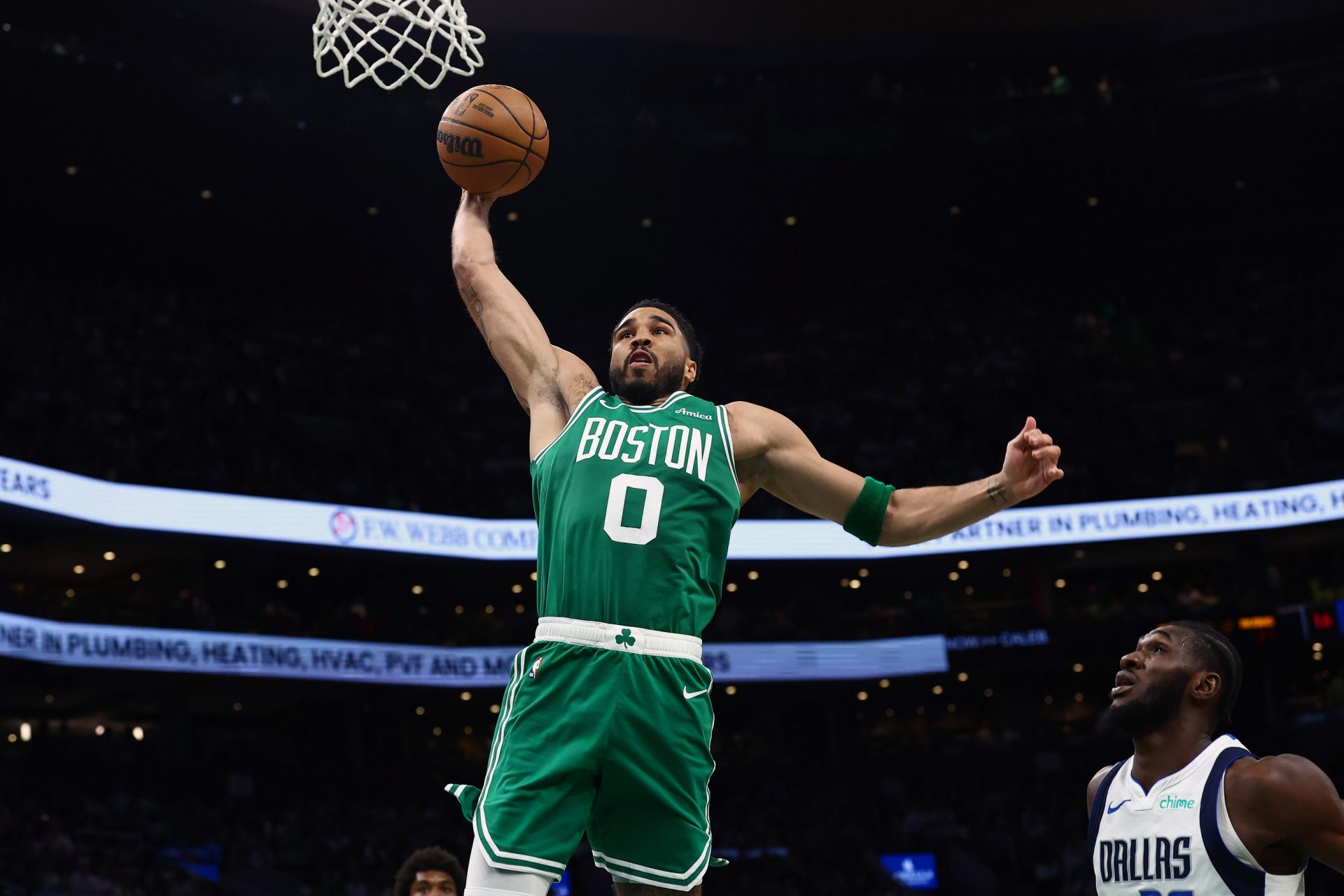 Boston Celtics forward Jayson Tatum (0) goes to the basket during the second quarter against the Dallas Mavericks at TD Garden. - Source: Imagn