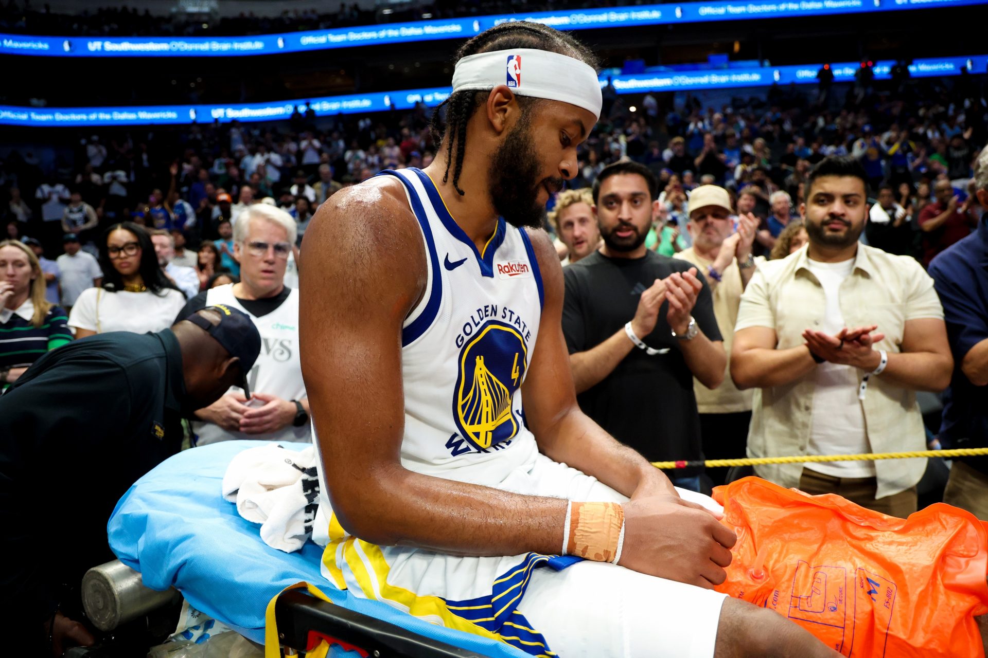 Golden State Warriors guard Moses Moody (4) leaves the court on a stretcher during overtime against the Dallas Mavericks at American Airlines Center. - Source: Imagn