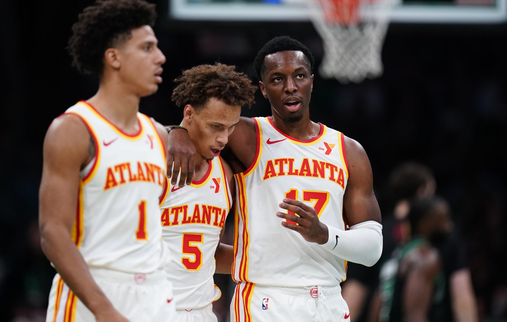 Atlanta Hawks forward Onyeka Okongwu (17), guard Dyson Daniels (5) and forward Jalen Johnson (1) walk to the bench during a break in the action against the Boston Celtics in the second half at TD Garden. - Source: Imagn