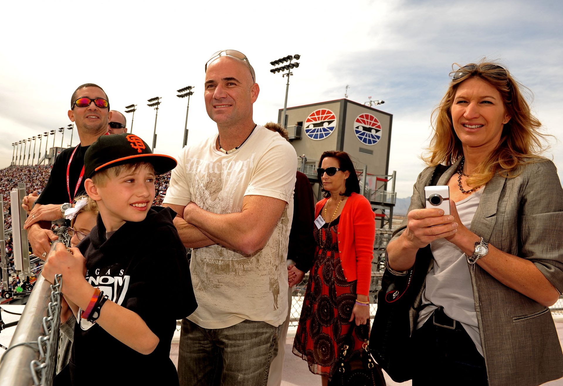 Mar. 6, 2011; Las Vegas, NV, USA; Former tennis players Andre Agassi (center) with wife Steffi Graf (right) and son Jaden Agassi in attendance during the Kobalt Tools 400 at Las Vegas Motor Speedway.