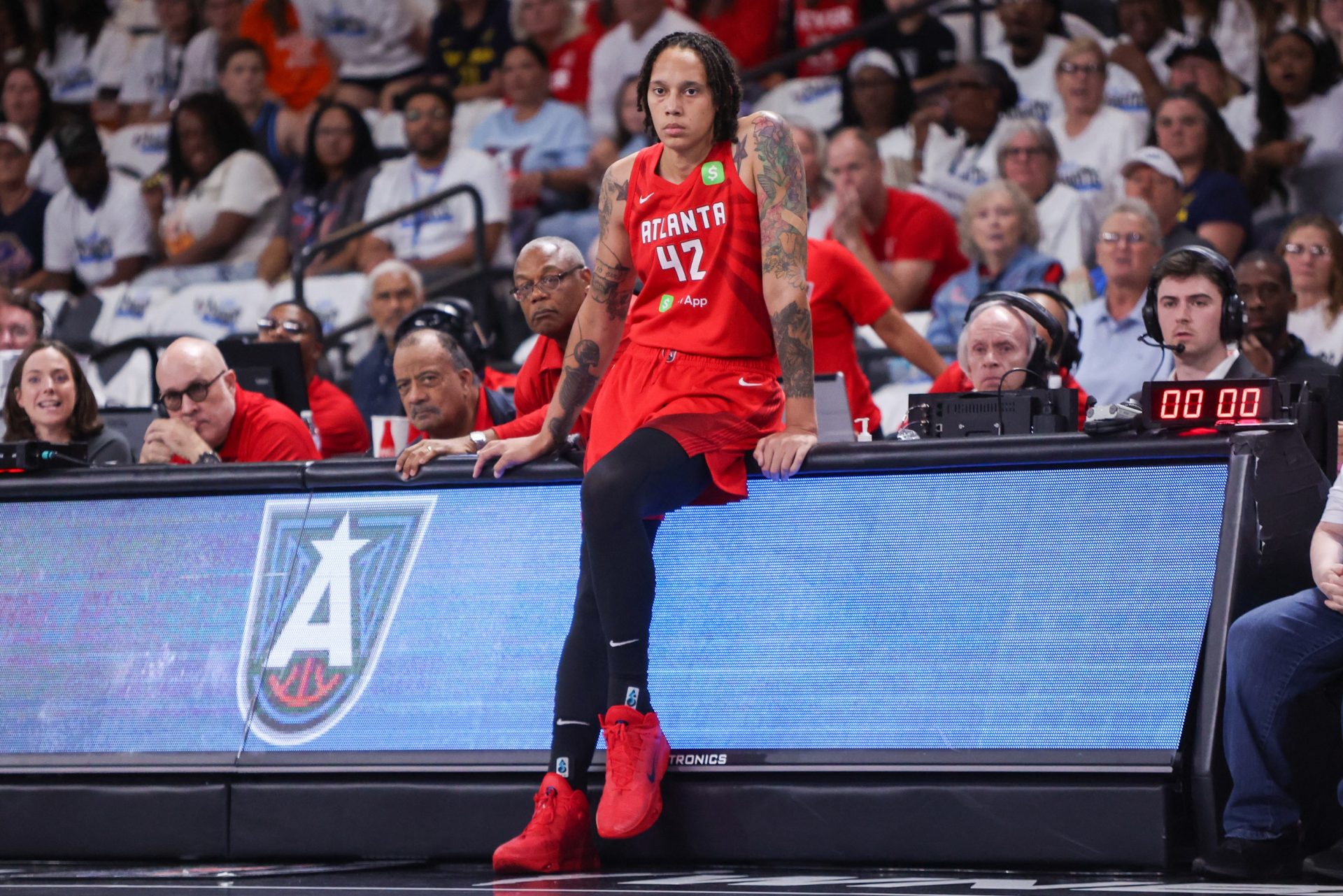 Atlanta Dream center Brittney Griner (42) waits to enter a game against the Indiana Fever in the first quarter during game one of round one for the 2025 WNBA Playoffs at Gateway Center Arena at College Park - Source: Imagn Images