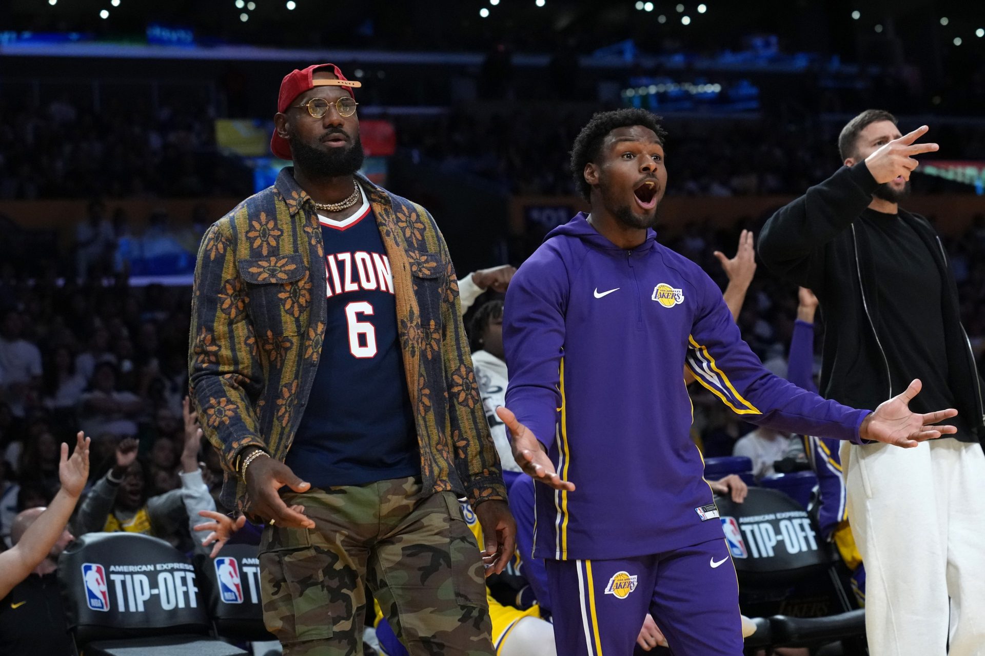 Los Angeles Lakers forward LeBron James (left) and son Bronny James (9) react in the second half against the Minnesota Timberwolves. - Source: Imagn