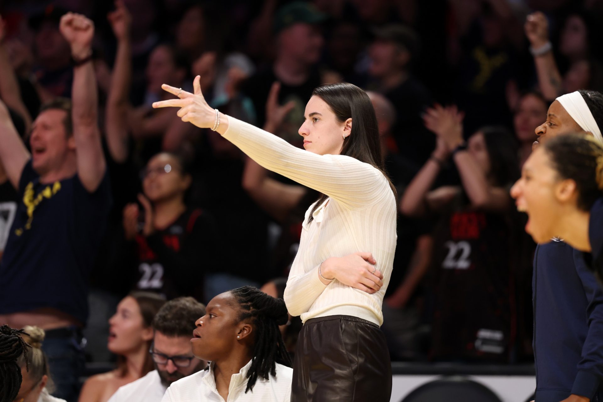 Indiana Fever guard Caitlin Clark (22) reacts after a teammate makes three point basket during the second half against the Los Angeles Sparks at Crypto.com Arena - Source: Imagn Images
