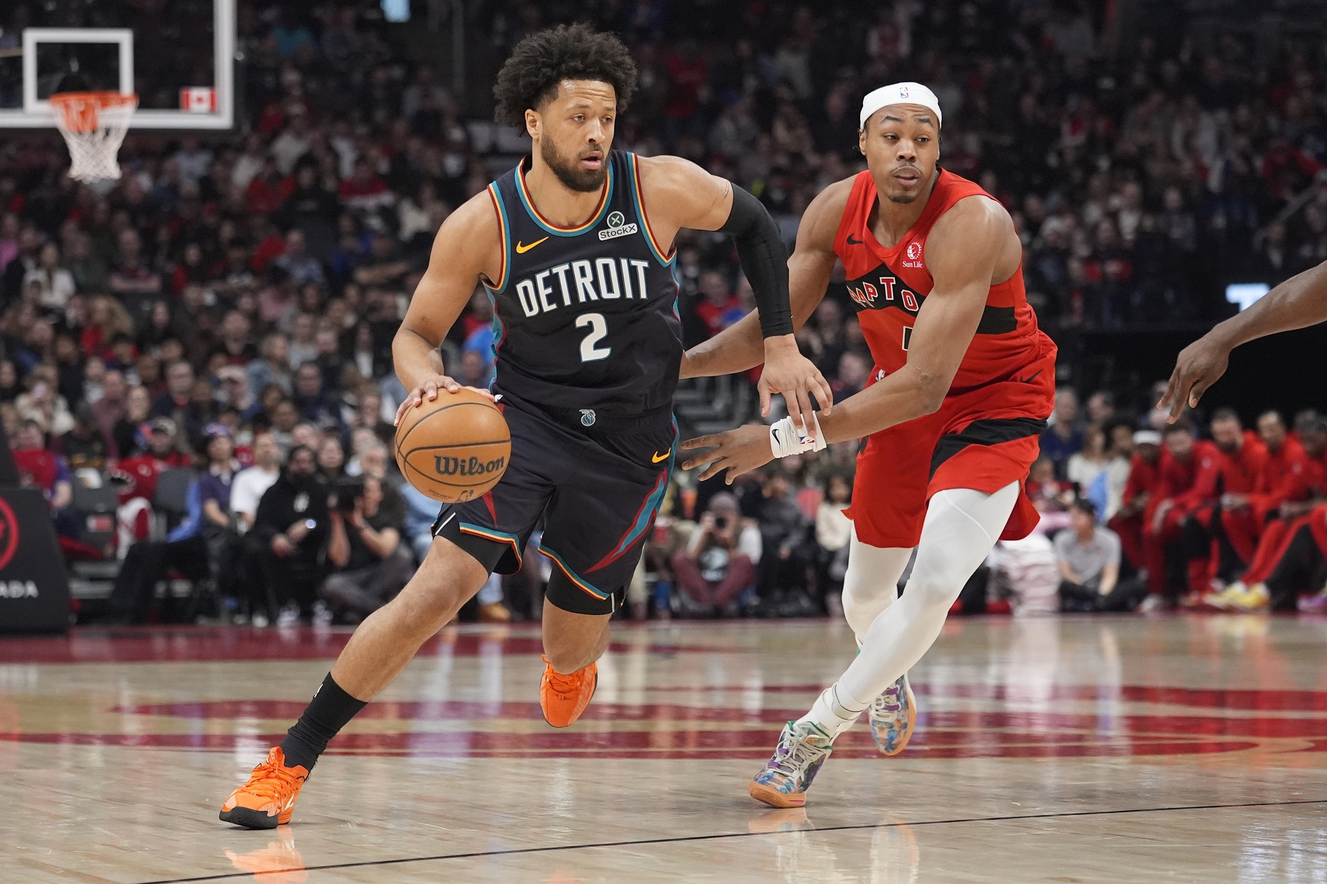 Detroit Pistons guard Cade Cunningham (2) drives to the basket against Toronto Raptors guard Scottie Barnes (4) during the first half at Scotiabank Arena - Source: Imagn Images