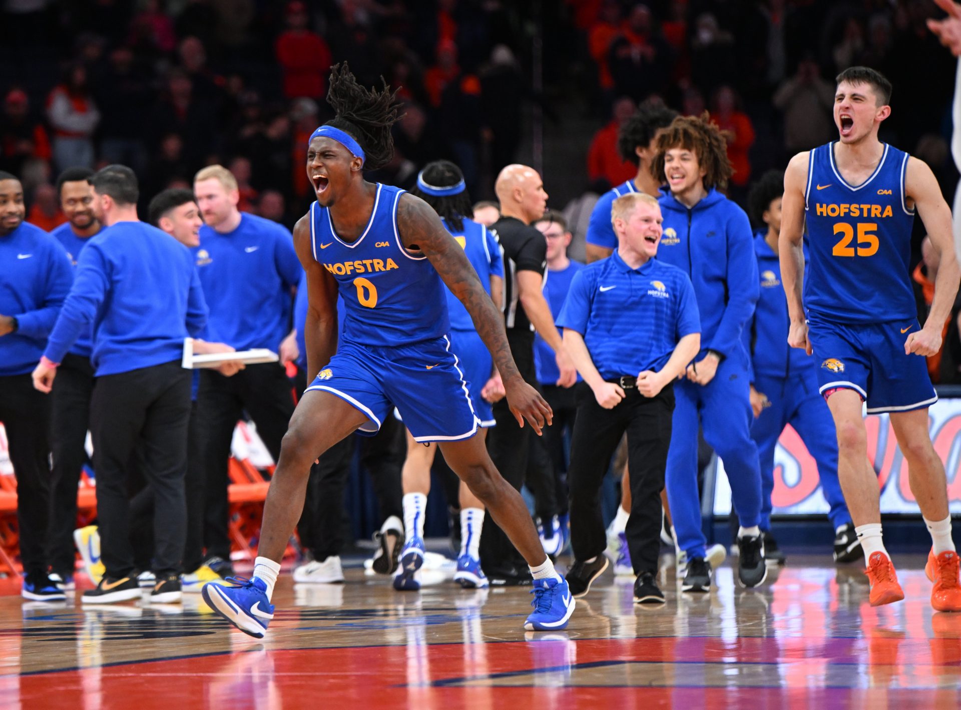 Hofstra Pride guard Biggie Patterson (0) and the bench react to winning a game against the Syracuse Orange -
Source: Imagn