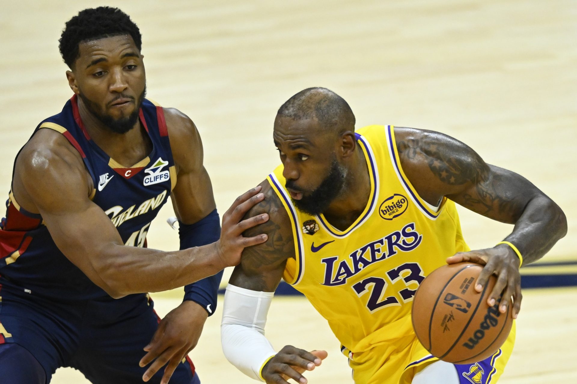 Cleveland Cavaliers guard Donovan Mitchell (45) defends Los Angeles Lakers forward LeBron James (23) in the fourth quarter at Rocket Arena.