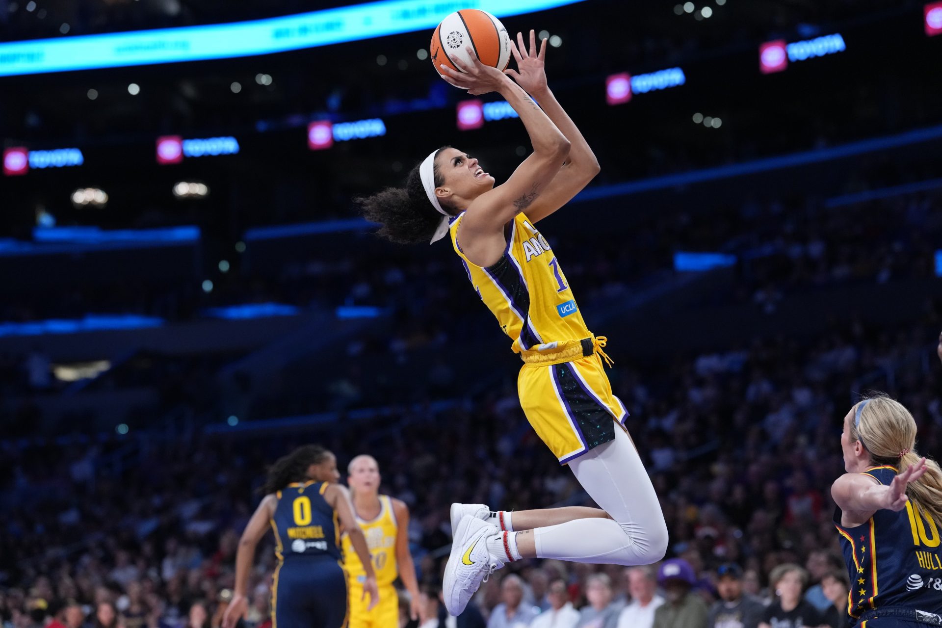LA Sparks guard Rae Burrell (12) goes up for a shot in the first half against the Indiana Fever at Crypto.com Arena.