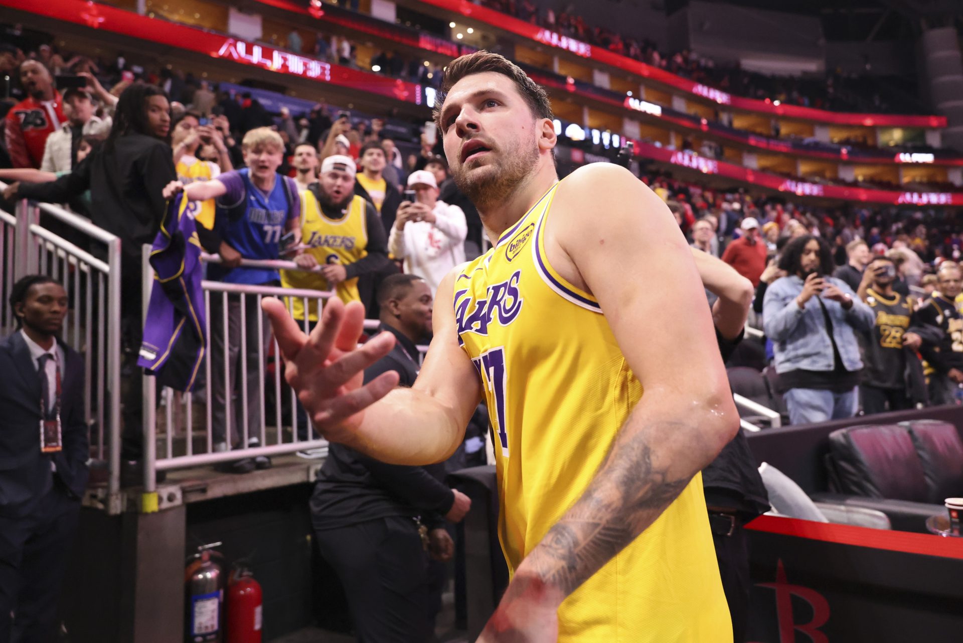 Los Angeles Lakers guard Luka Doncic (77) throws a wrist band into the crowd after the game against the Houston Rockets at Toyota Center - Source: Imagn Images
