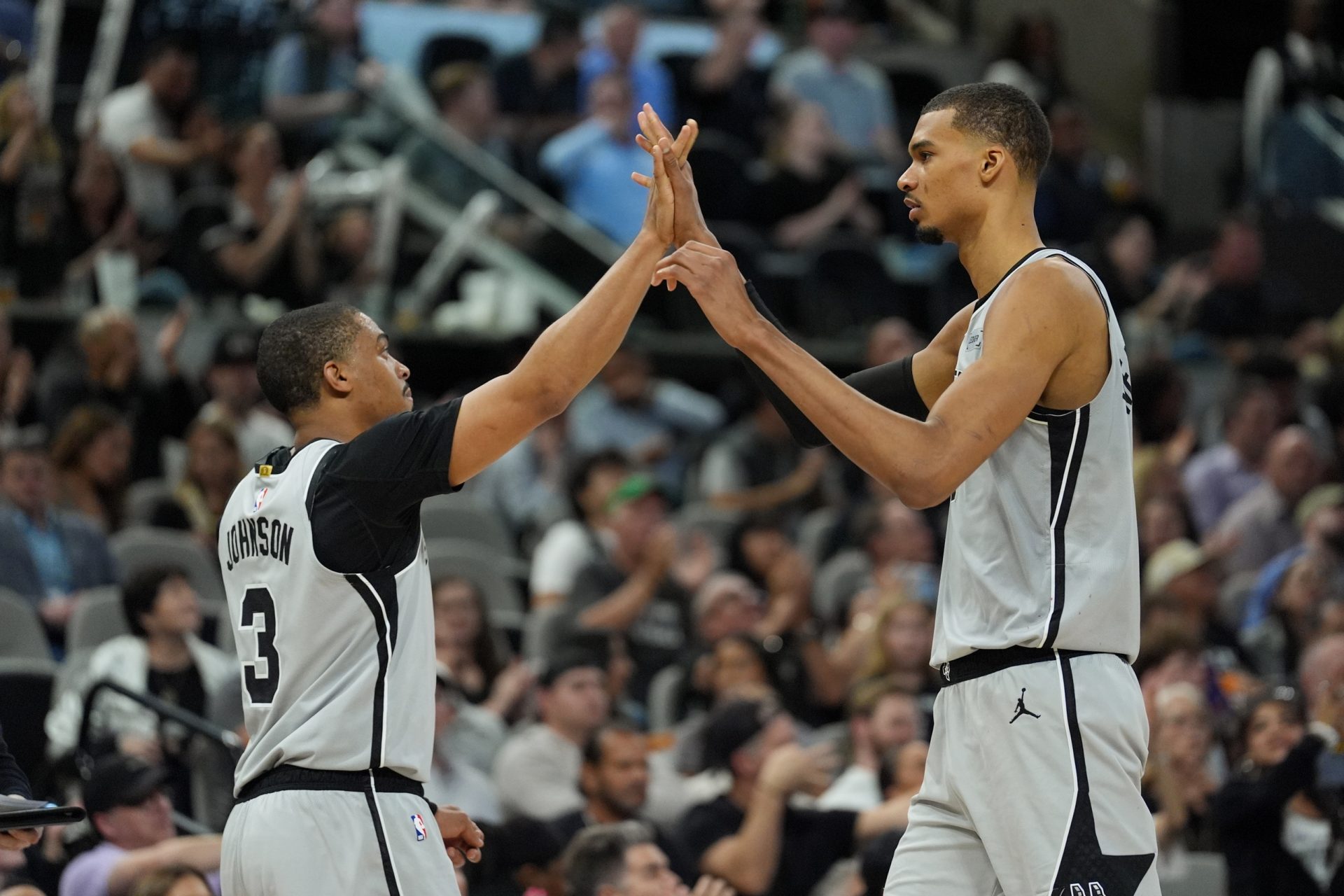 San Antonio Spurs forwards Keldon Johnson (3) and Victor Wembanyama (1) celebrate in the second half against the Phoenix Suns at Frost Bank Center - Source: Imagn Images
