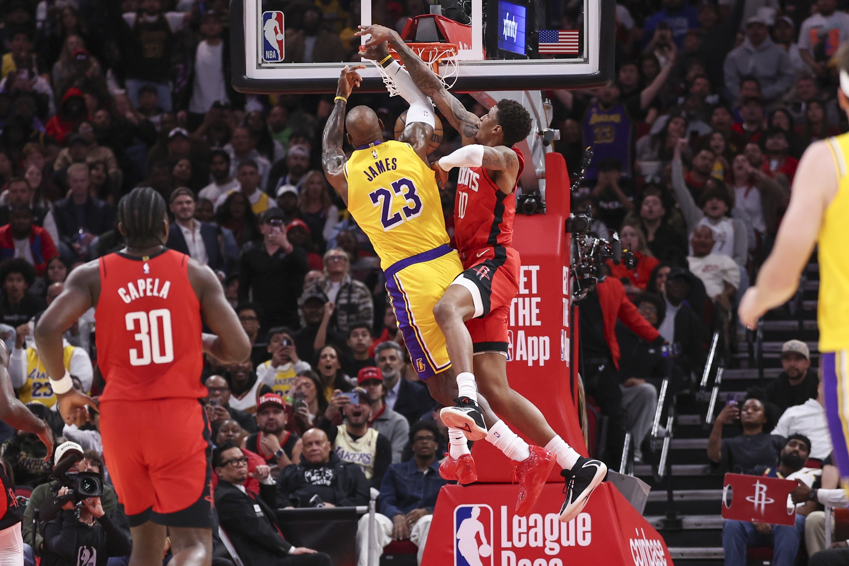 Los Angeles Lakers forward LeBron James (23) attempts to dunk the ball as Houston Rockets forward Jabari Smith Jr. (10) defends during the first quarter at Toyota Center. - Source: Imagn