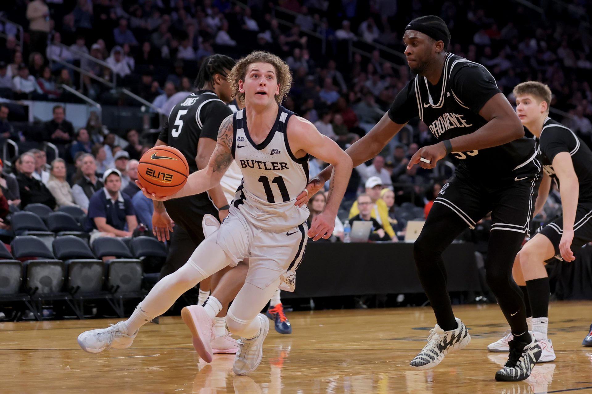 Butler Bulldogs guard Finley Bizjack (11) drives to the basket against Providence Friars forward Oswin Erhunmwunse (55) during the second half at Madison Square Garden. Source: Imagn