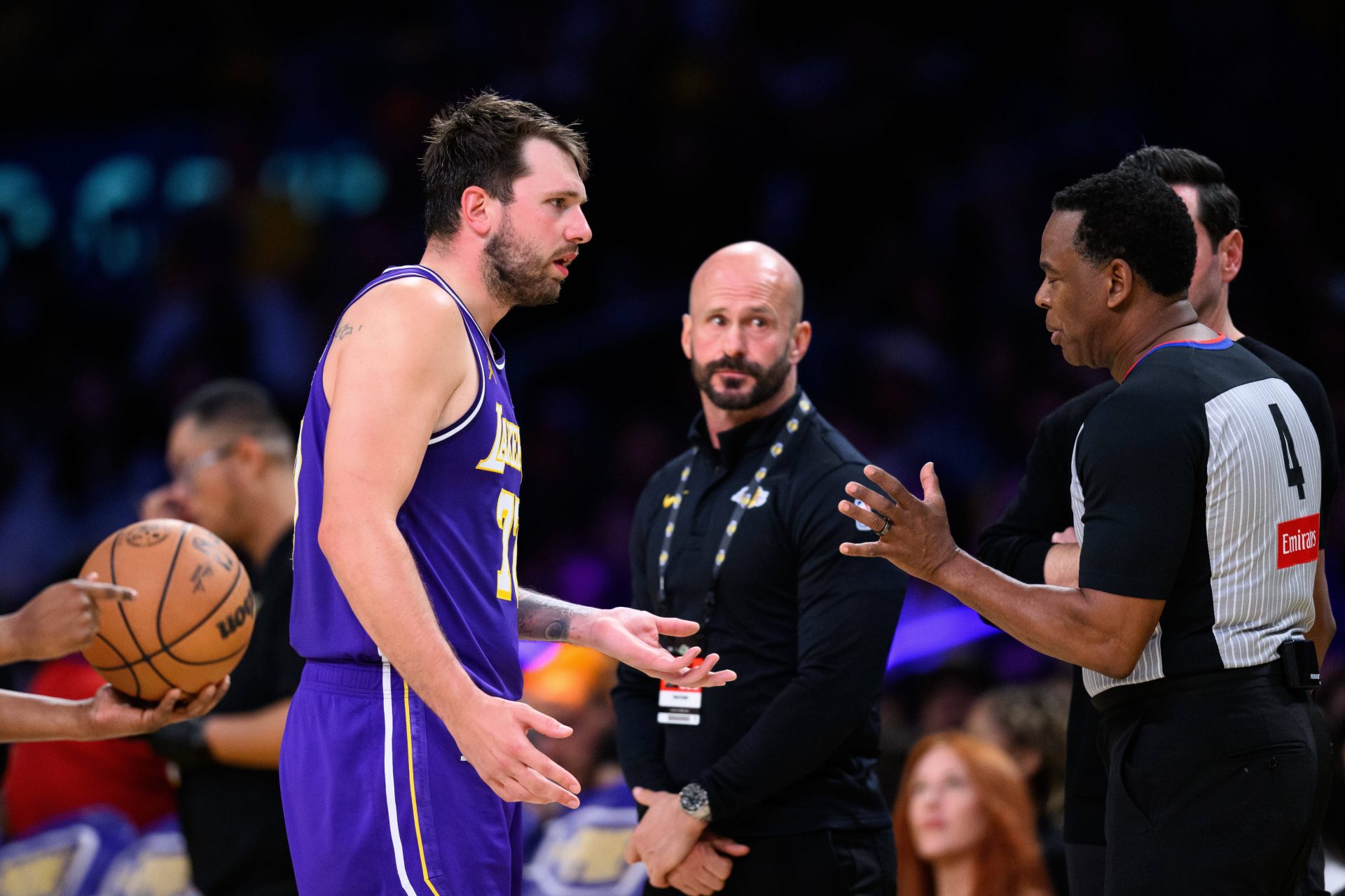 Los Angeles Lakers guard Luka Doncic (77) talks to referee Sean Wright (4) during the second half against the Brooklyn Nets at Crypto.com Arena.
