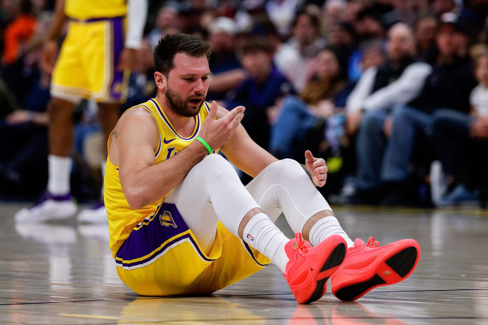 Los Angeles Lakers guard Luka Doncic (77) reacts after a play in the first quarter against the Denver Nuggets at Ball Arena - Source: Imagn Images