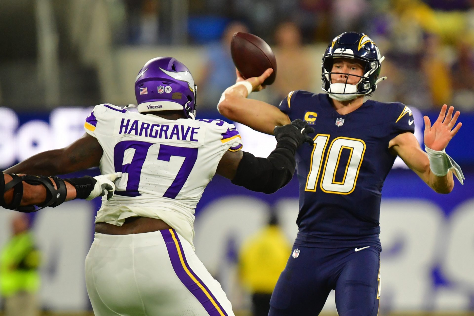 Minnesota Vikings defensive tackle Javon Hargrave (97) gets pressure on Los Angeles Chargers quarterback Justin Herbert (10) during the first half at SoFi Stadium. Source: Gary A. Vasquez-Imagn Images