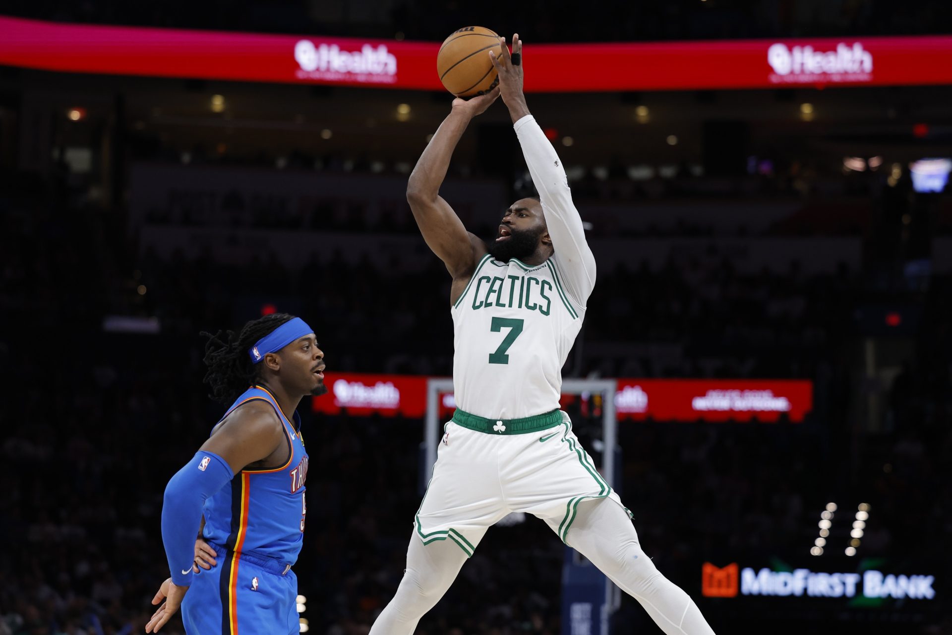 Boston Celtics guard/forward Jaylen Brown (7) shoots over Oklahoma City Thunder guard Luguentz Dort (5) during the fourth quarter at Paycom Center. - Source: Imagn