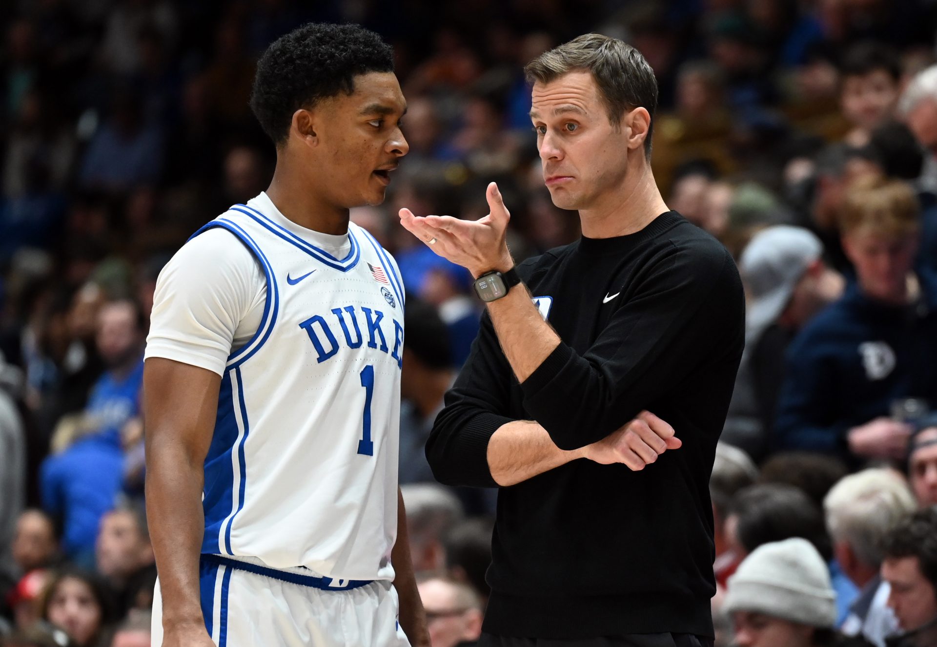 Duke Blue Devils head coach Jon Scheyer (right) talks to guard Caleb Foster (1) during the second half against the Louisville Cardinals at Cameron Indoor Stadium - Source: Imagn