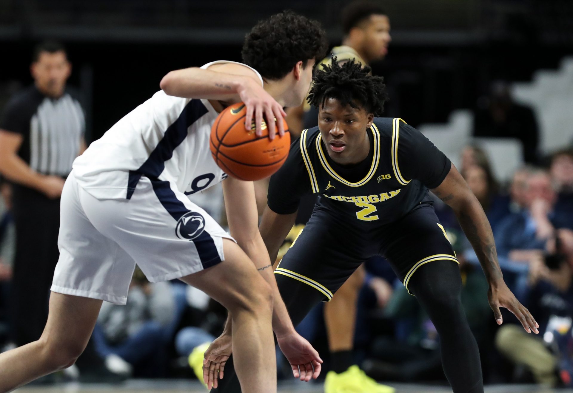 Michigan Wolverines guard LJ Cason (2) defends Penn State Nittany Lions guard Melih Tunca (9) during the second half at Bryce Jordan Center.
