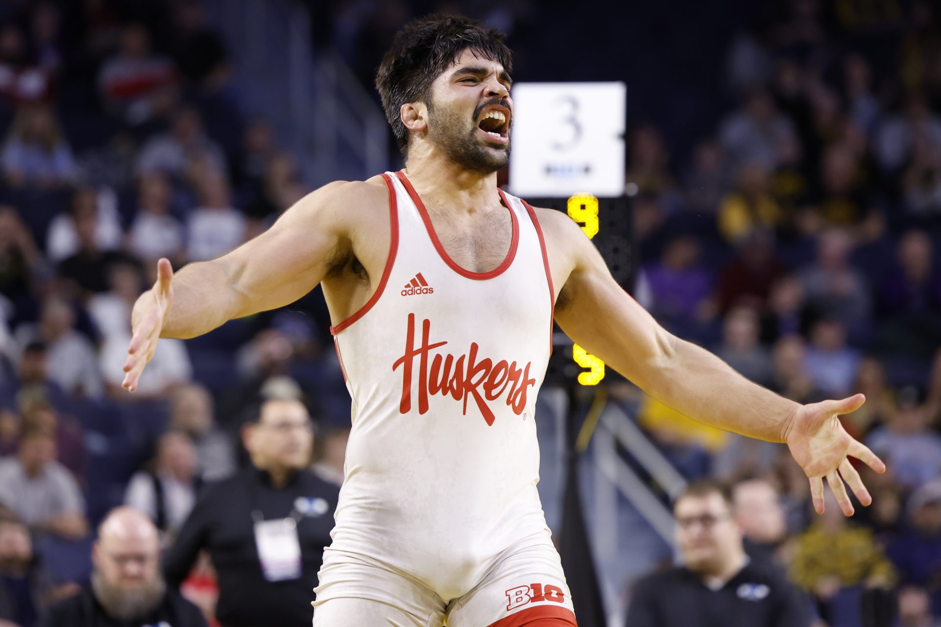 Nebraska Cornhuskers wrestler Silas Allred celebrates his win during the Big Ten Championship at Crisler Center.
