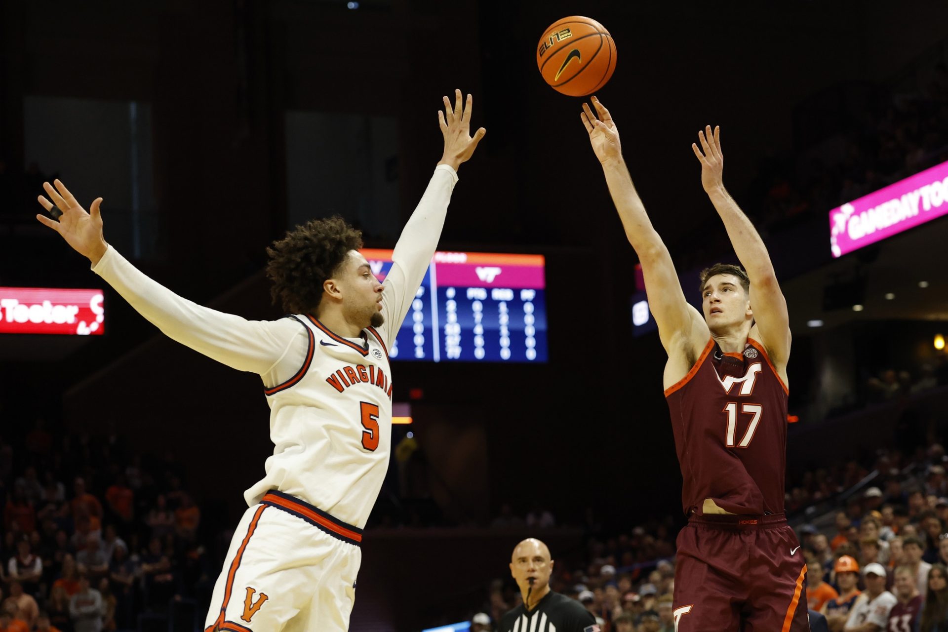 Virginia Tech Hokies guard Neoklis Avdalas (17) shoots the ball over Virginia Cavaliers guard Sam Lewis (5) in the first half at John Paul Jones Arena. 
Source: Imagn