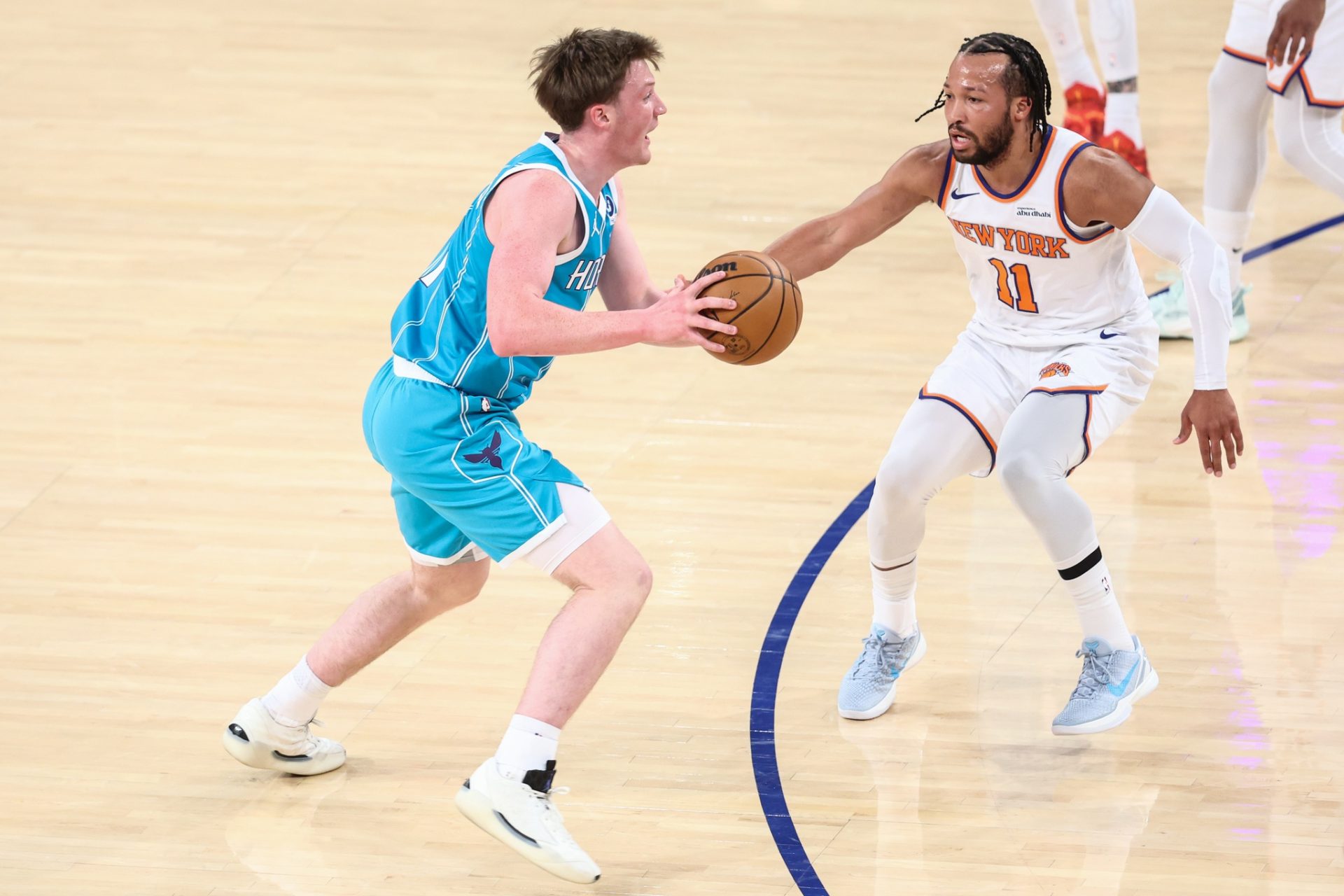 Charlotte Hornets guard Kon Knueppel (7) looks to drive past New York Knicks guard Jalen Brunson (11) in the first quarter at Madison Square Garden.