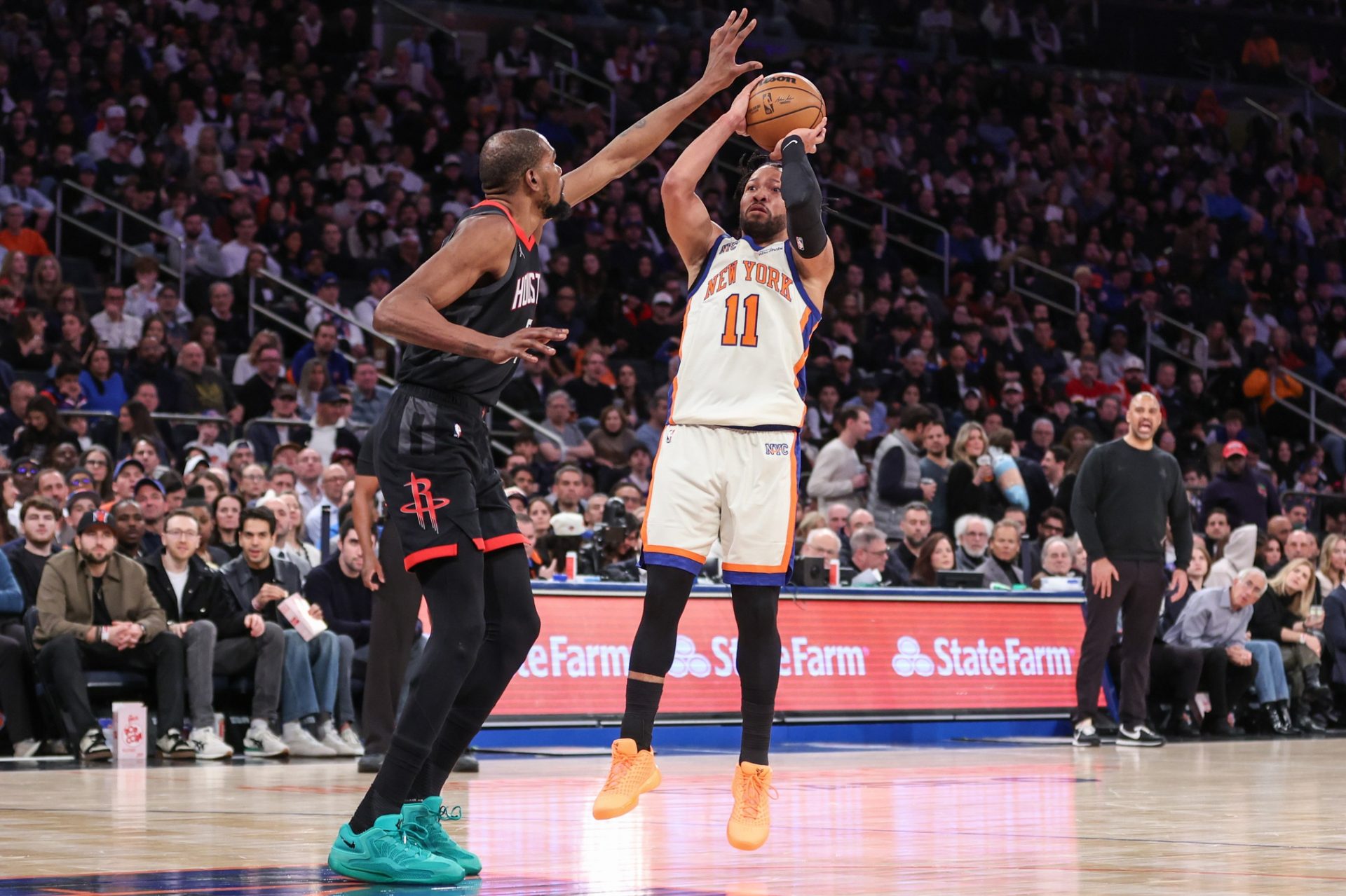New York Knicks guard Jalen Brunson (11) shoots past Houston Rockets forward Kevin Durant (7) in the third quarter at Madison Square Garden.