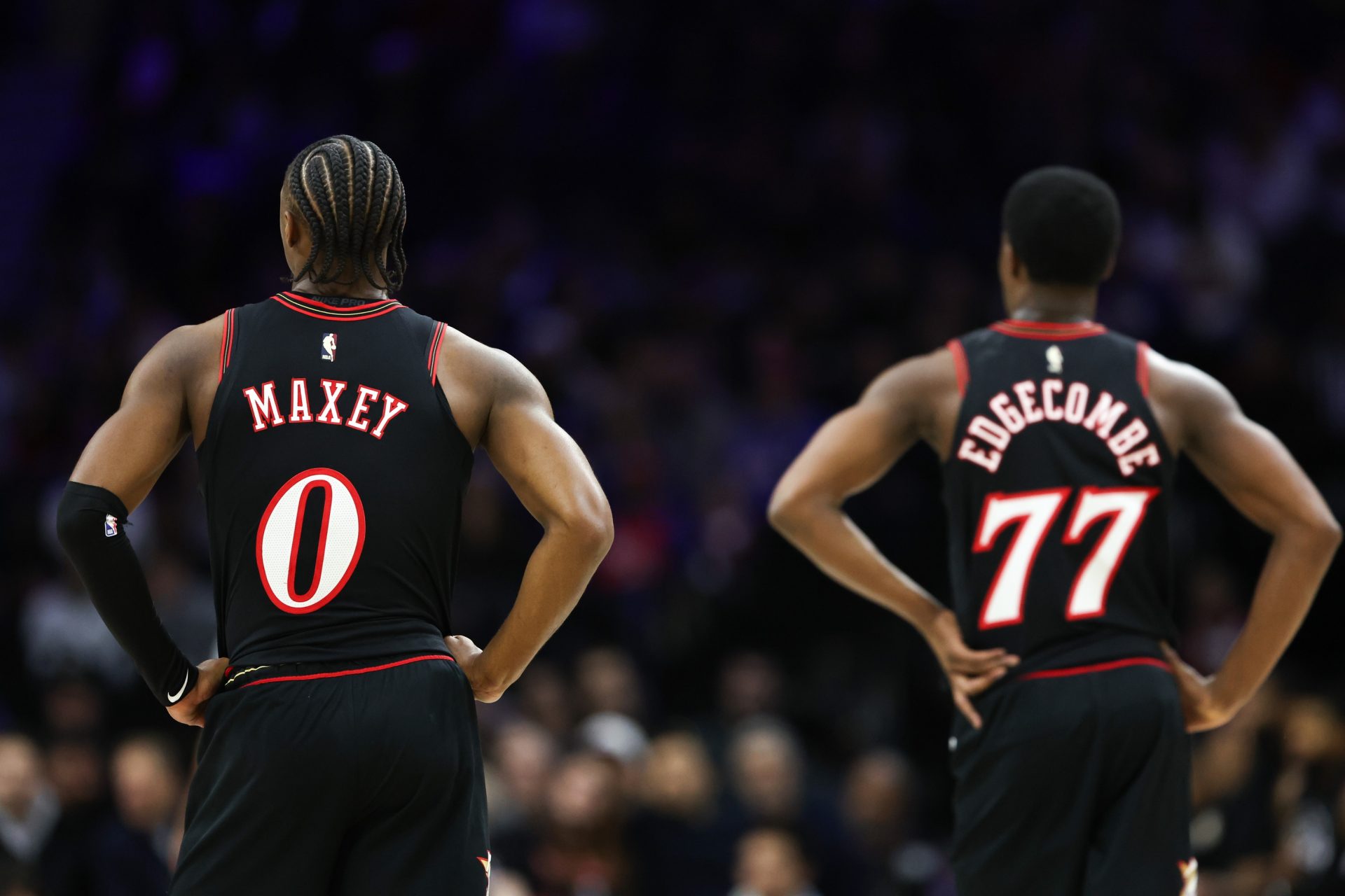 Philadelphia 76ers guard Tyrese Maxey (0) and guard Vj Edgecombe (77) look on during a break in the second quarter against the New York Knicks at Xfinity Mobile Arena.