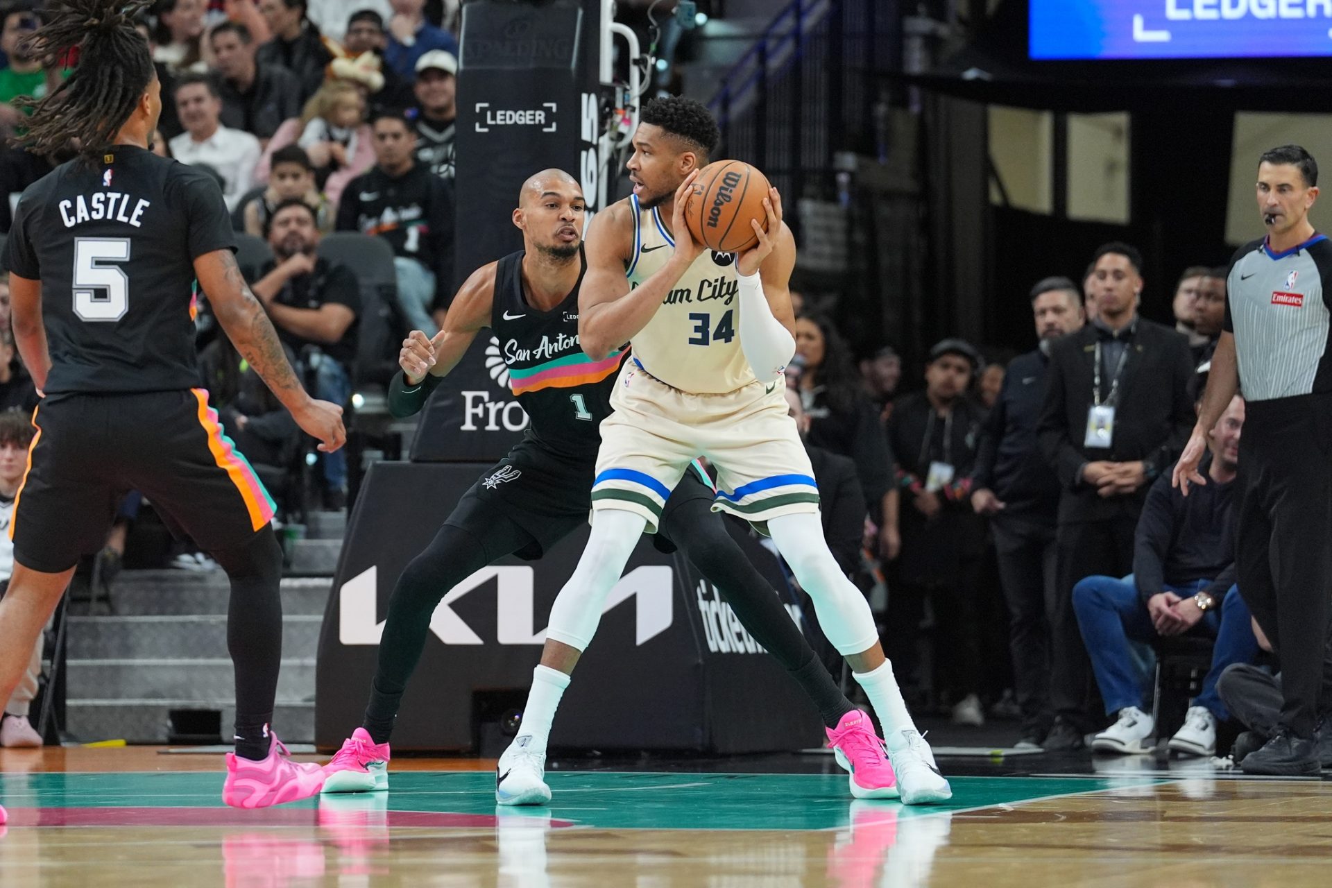 Milwaukee Bucks forward Giannis Antetokounmpo (34) backs up against San Antonio Spurs forward/center Victor Wembanyama (1) in the first half at Frost Bank Center.