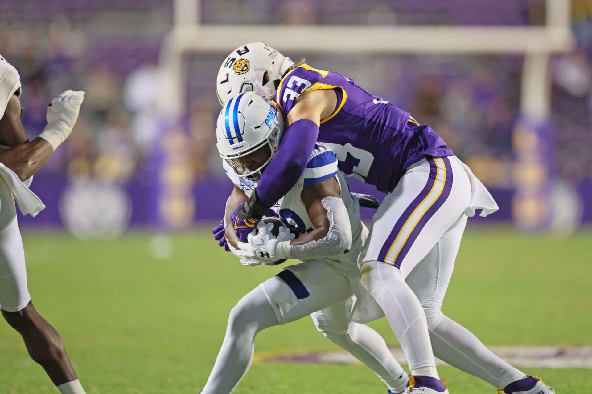 Georgia State Panthers running back Terry Berdin Jr. (28) is tackled by LSU Tigers linebacker West Weeks (33) in third quarter action at Tiger Stadium - Source: Imagn
