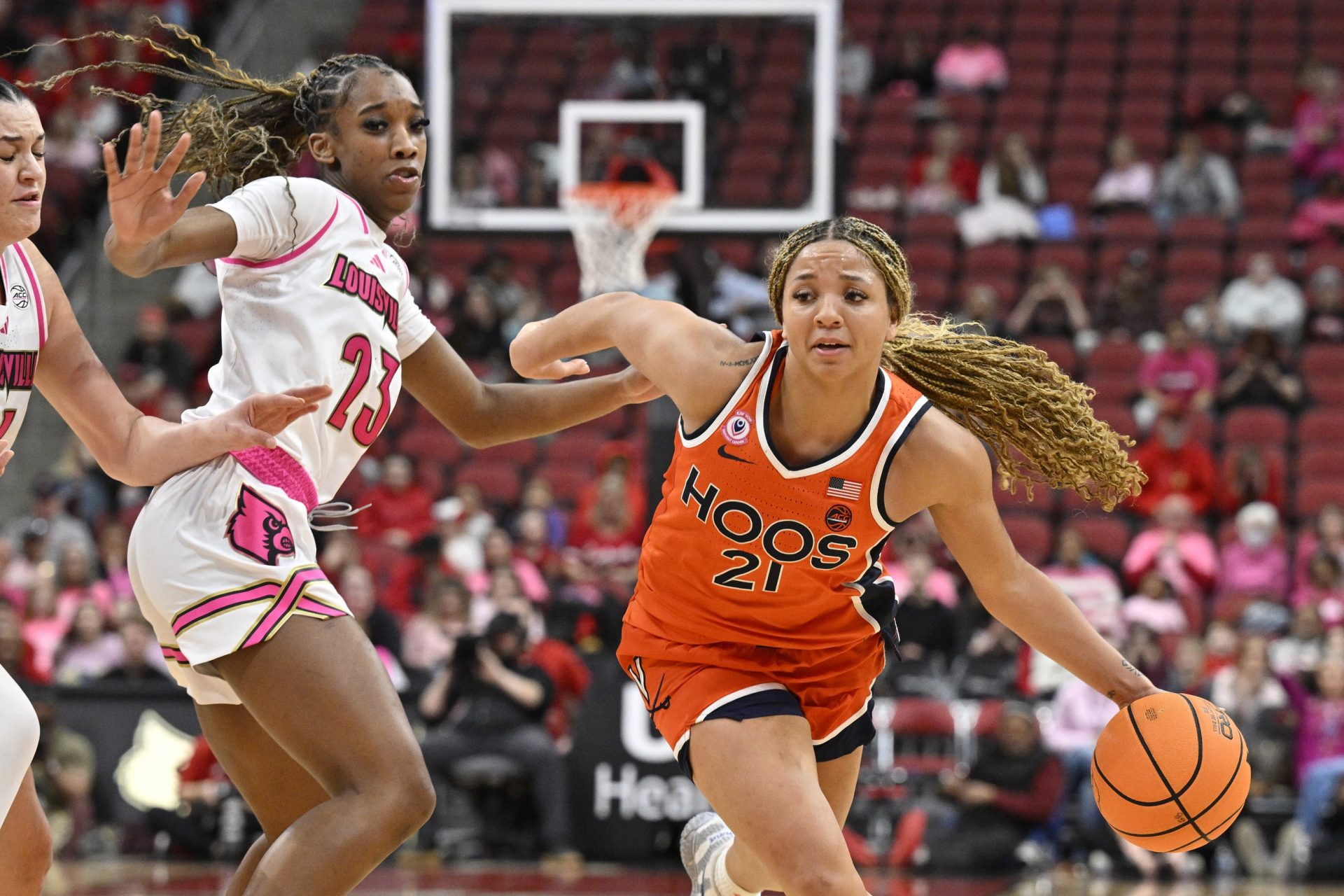 Virginia Cavaliers guard Kymora Johnson (21) dribbles against Louisville Cardinals guard Skylar Jones (23) during the second half at KFC Yum! Center - Source: Imagn