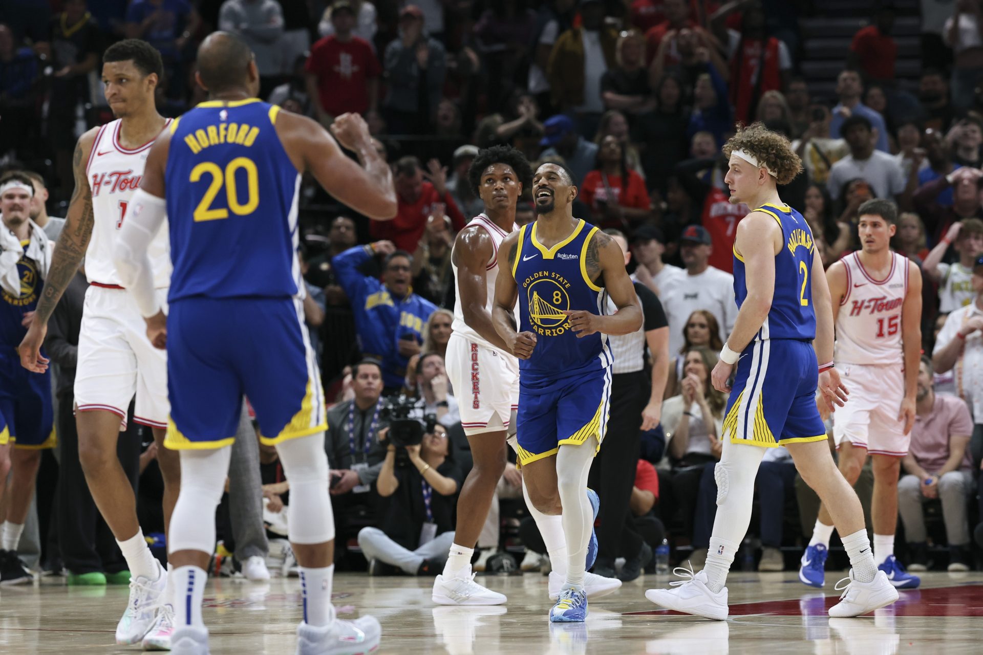 Golden State Warriors guard De'anthony Melton (8) celebrates after scoring a basket during overtime against the Houston Rockets at Toyota Center.