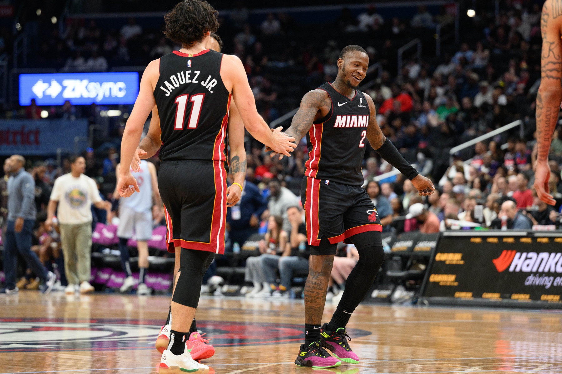 Miami Heat guard Terry Rozier (2) and guard Jaime Jaquez Jr. (11) celebrates during the fourth quarter against the Washington Wizards at Capital One Arena - Source: Imagn Images