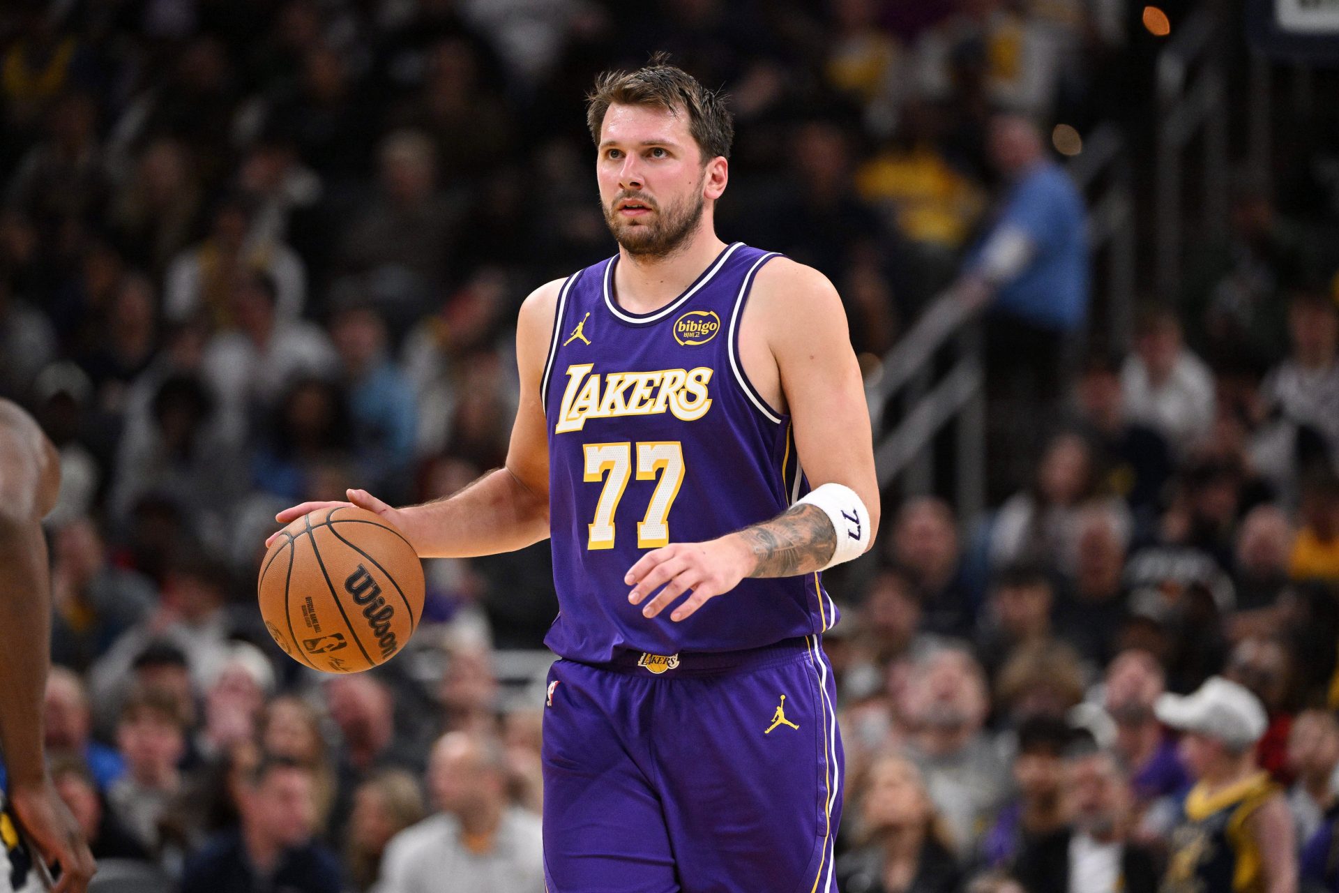 Los Angeles Lakers guard Luka Doncic (77) dribbles the ball down court during the second half against the Indiana Pacers at Gainbridge Fieldhouse - Source: Imagn Images