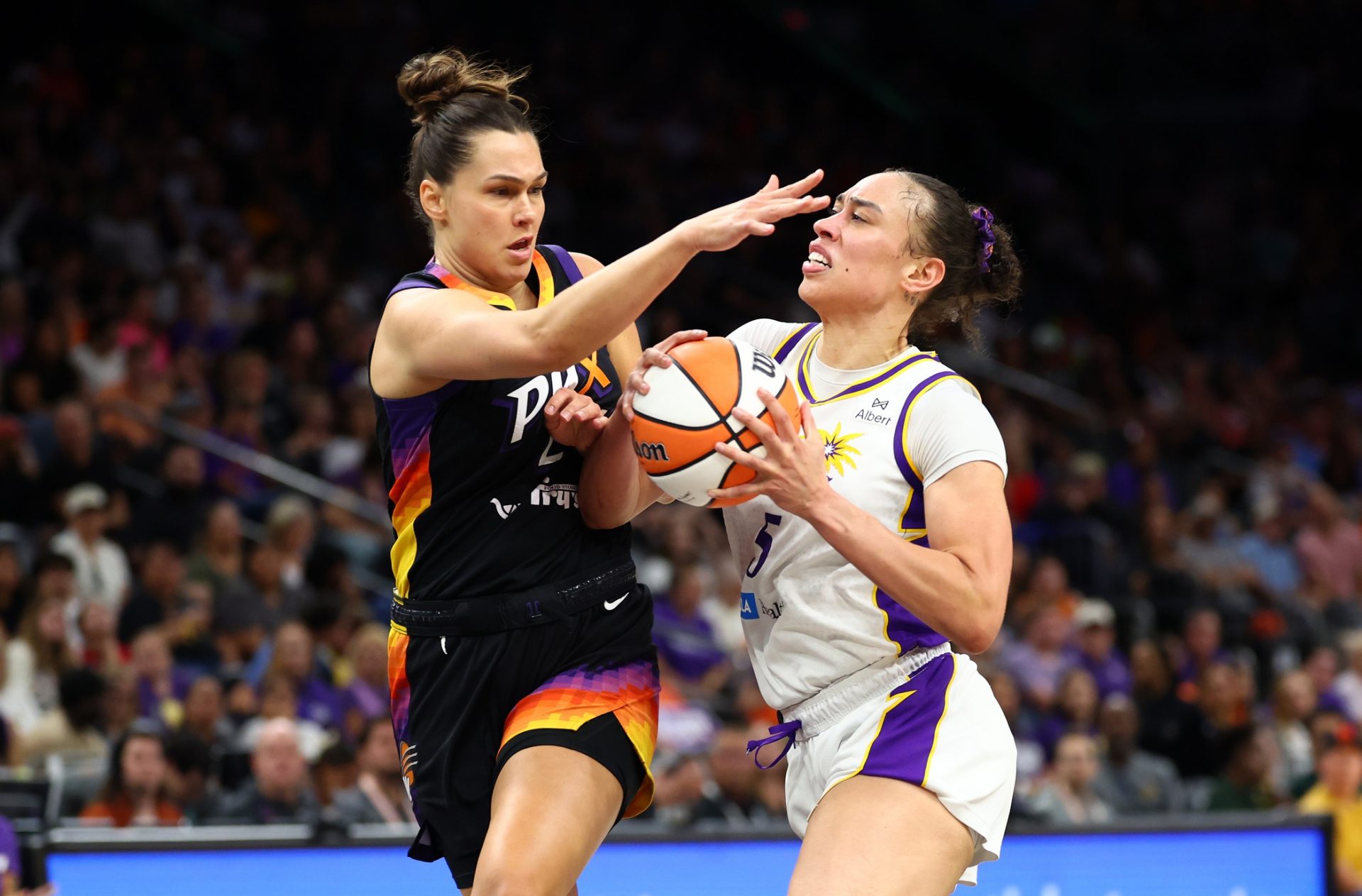 Los Angeles Sparks forward Dearica Hamby (5) moves the ball against Phoenix Mercury forward Kathryn Westbeld (24) during the first half of a WNBA game at PHX Arena - Source: Imagn Images