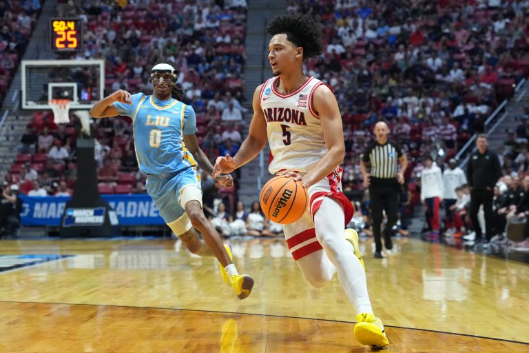 Arizona Wildcats guard Brayden Burries (5) controls the ball against LIU Sharks guard Malachi Davis (0) in the first half during a first round game of the men's 2026 NCAA Tournament at Viejas Arena - Source: Imagn