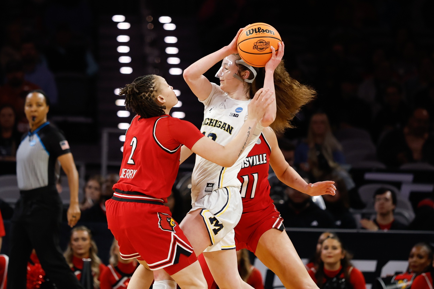 Michigan Wolverines guard Syla Swords (12) looks to pass between Louisville Cardinals guard Imari Berry (2) and forward Elif Istanbulluoglu (11) during the first half at Dickies Arena. Source: Imagn