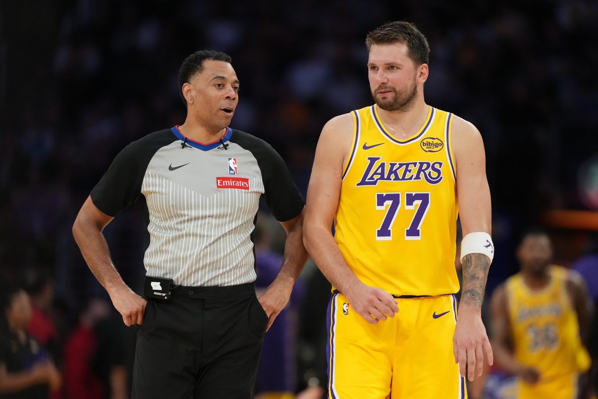 Los Angeles Lakers guard Luka Doncic (77) talks with referee Karl Lane (77) against the Indiana Pacers in the second half at Crypto.com Arena - Source: Imagn Images
