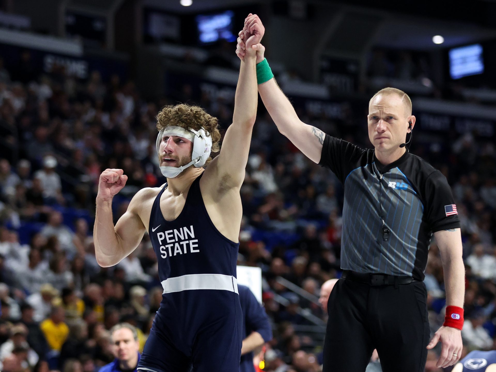 Penn State’s Mitchell Mesenbrink has his arm raised after defeating Ohio State’s Paddy Gallagher (not pictured) in a 165-pound bout during the quarterfinals of the Big Ten Wrestling Championships at Bryce Jordan Center.
